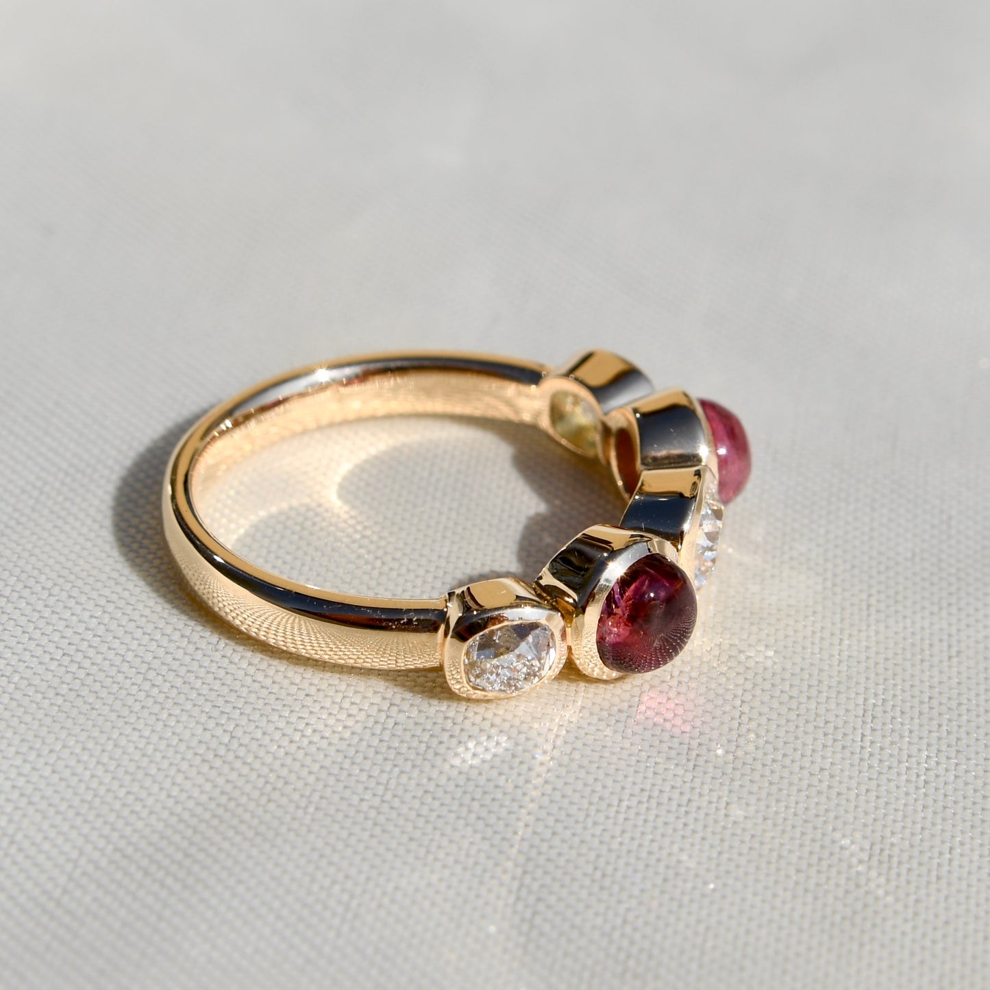 0.96 ct old mine cut diamond and tourmaline five stone ring