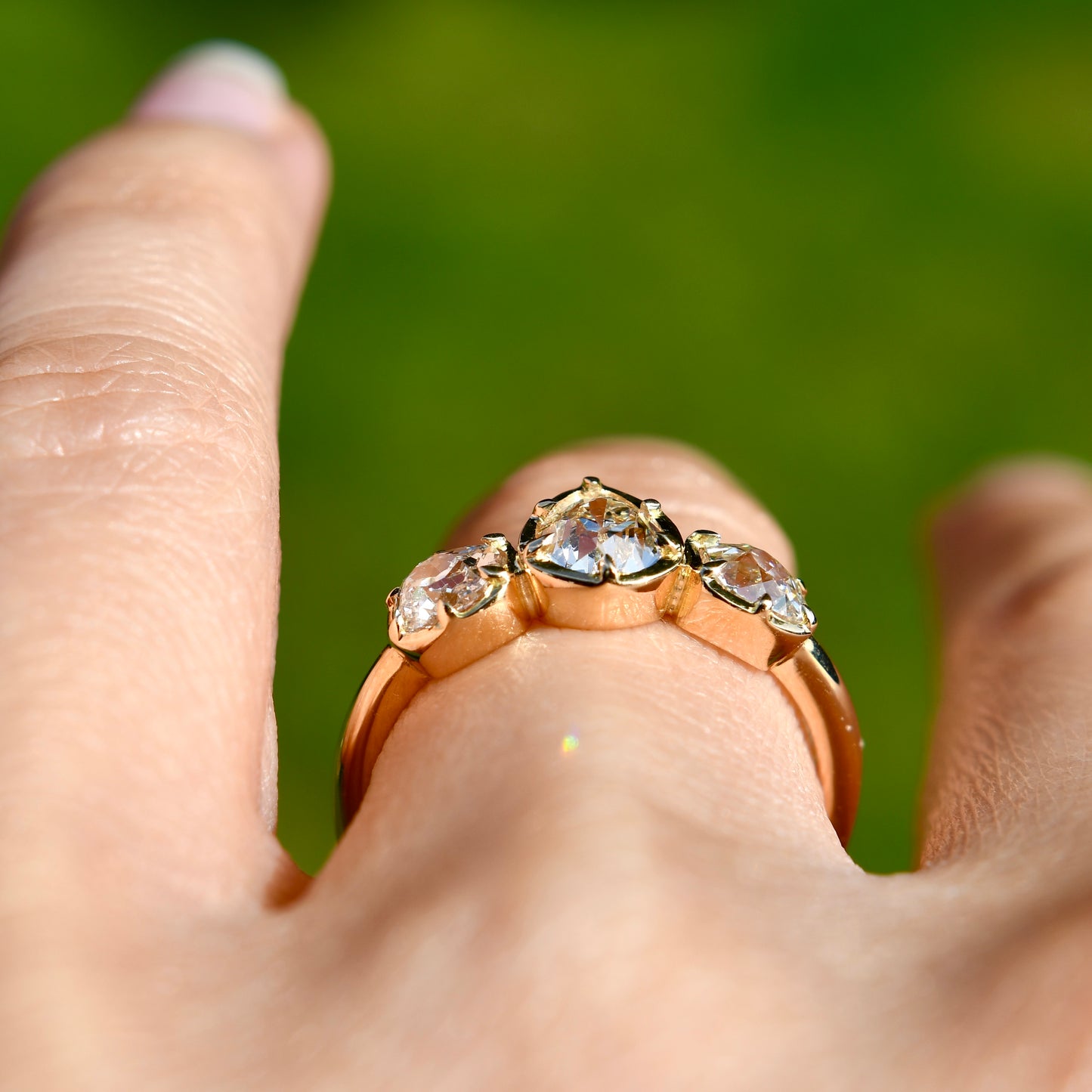 0.61 ct old pear and old mine cut diamond three stone ring