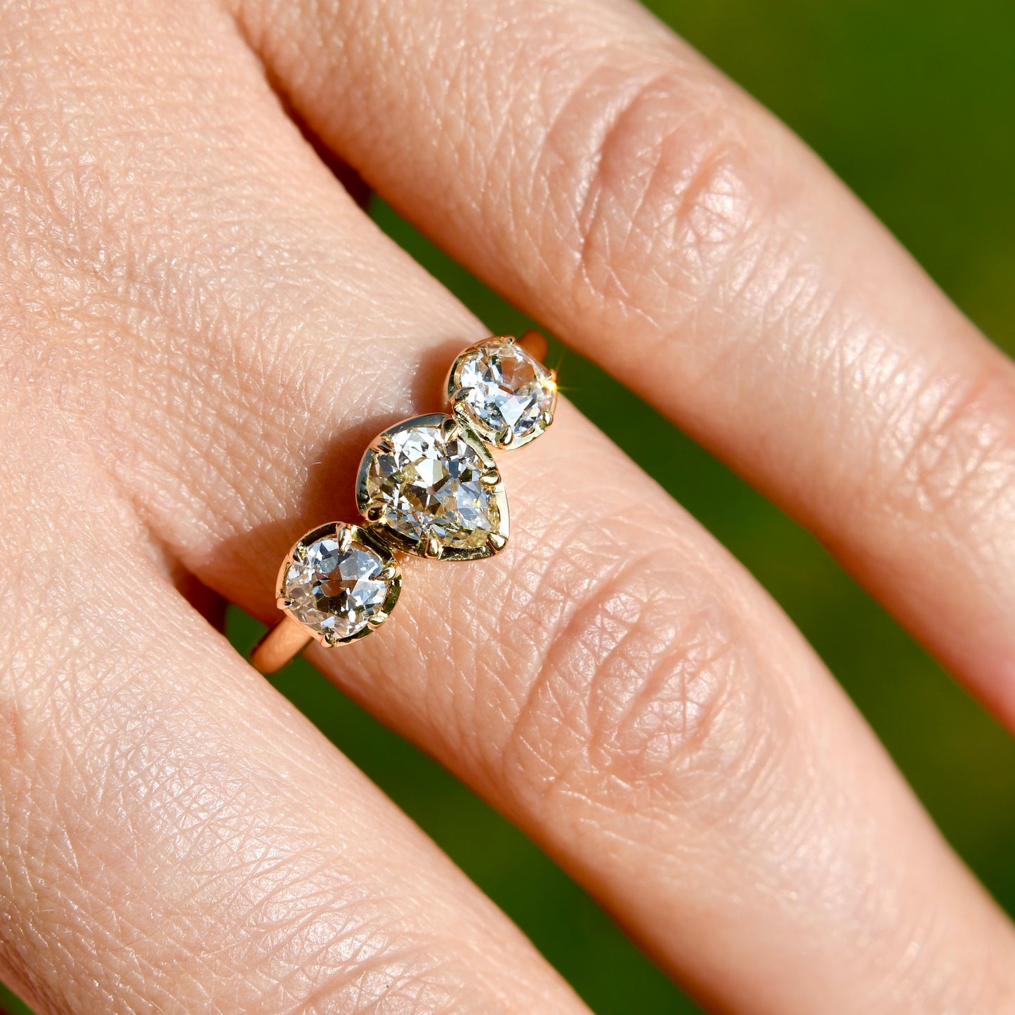0.61 ct old pear and old mine cut diamond three stone ring