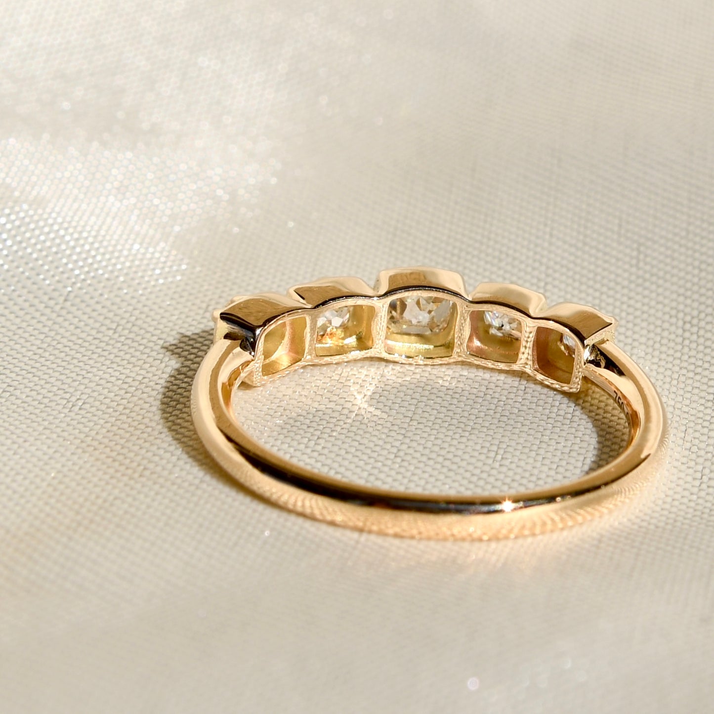 0.60 ct peruzzi cut diamond five stone band ring