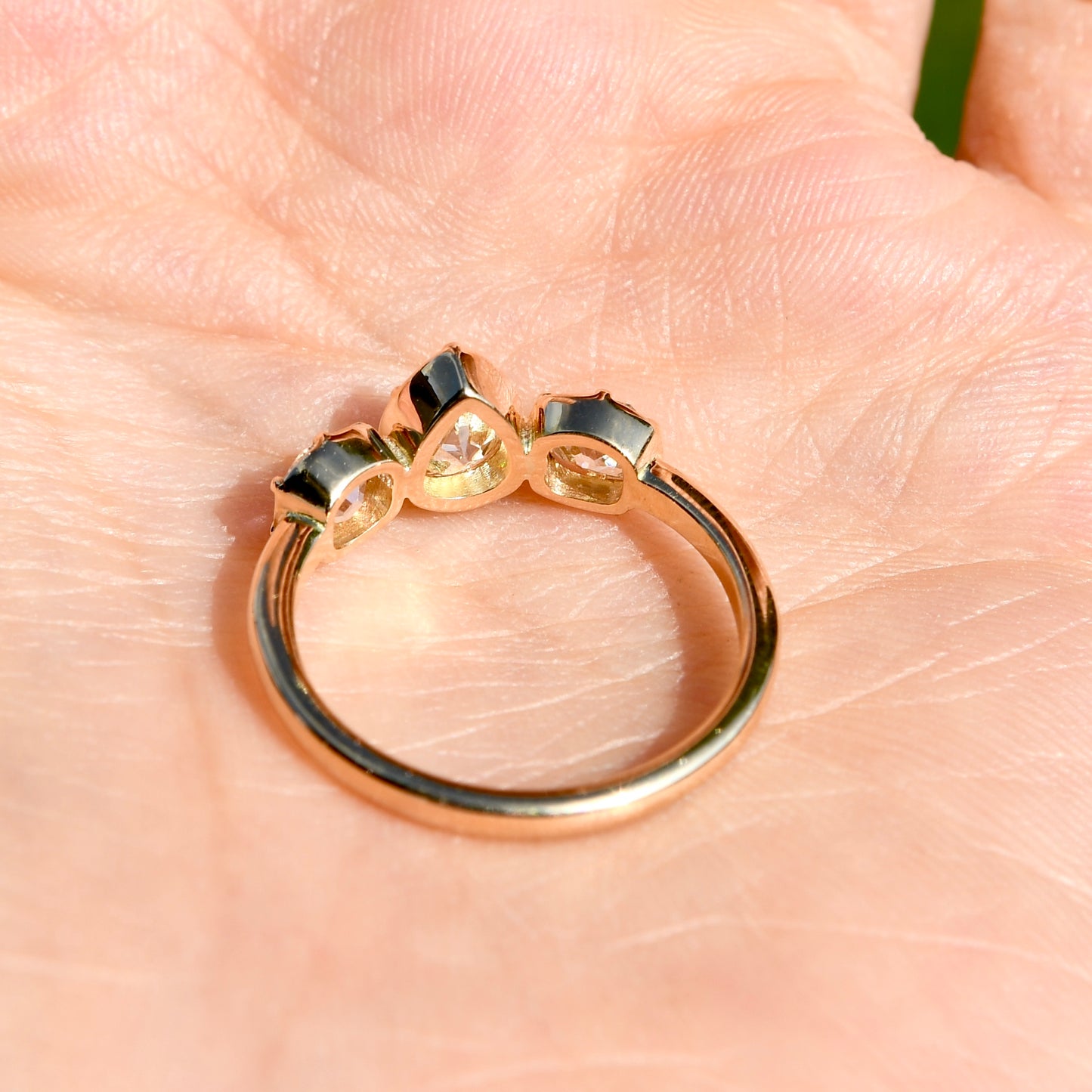 0.61 ct old pear and old mine cut diamond three stone ring