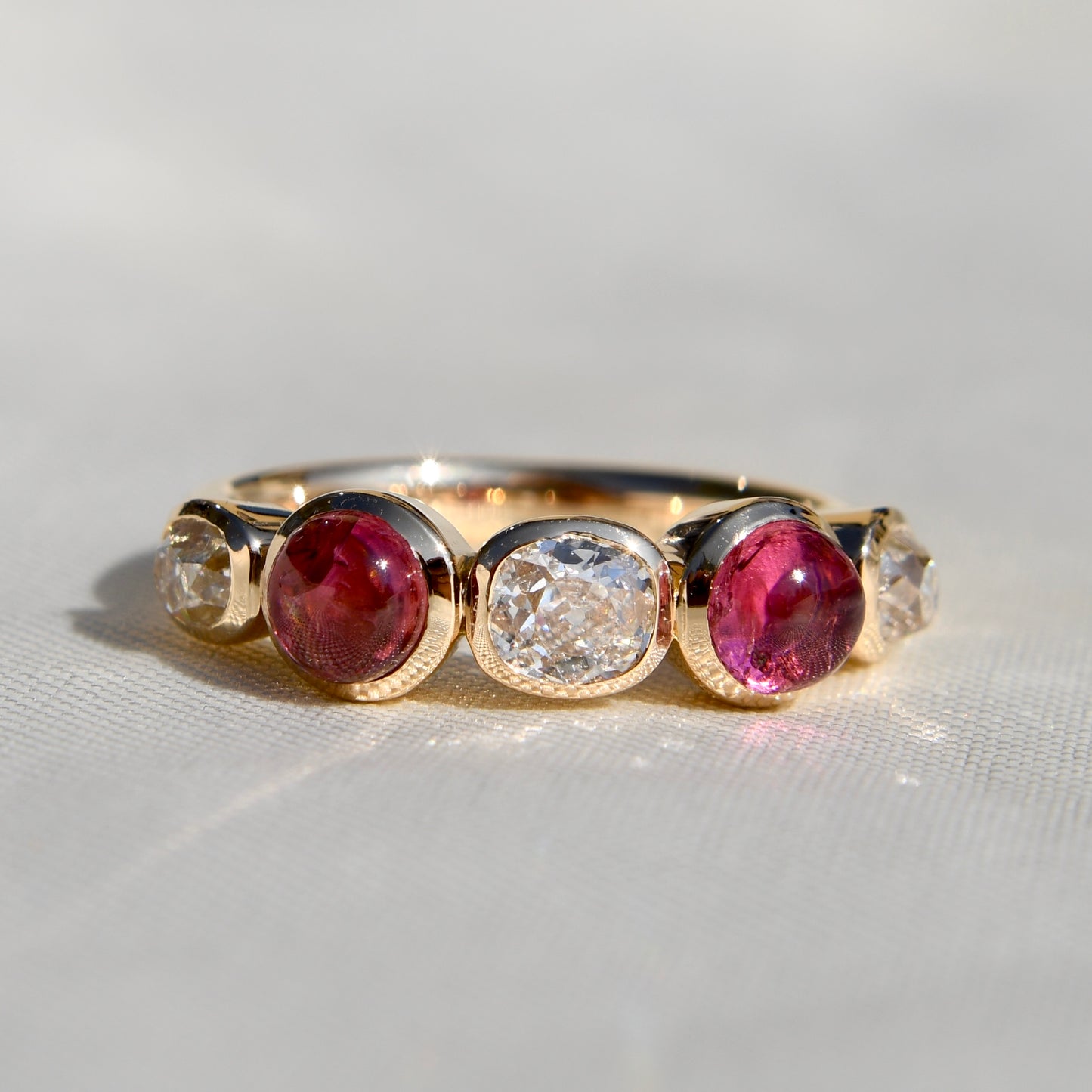 0.96 ct old mine cut diamond and tourmaline five stone ring