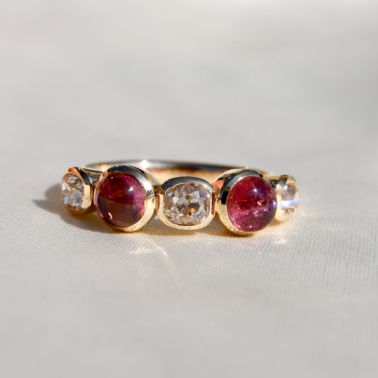 1.02 ct old mine cut diamond and tourmaline five stone ring