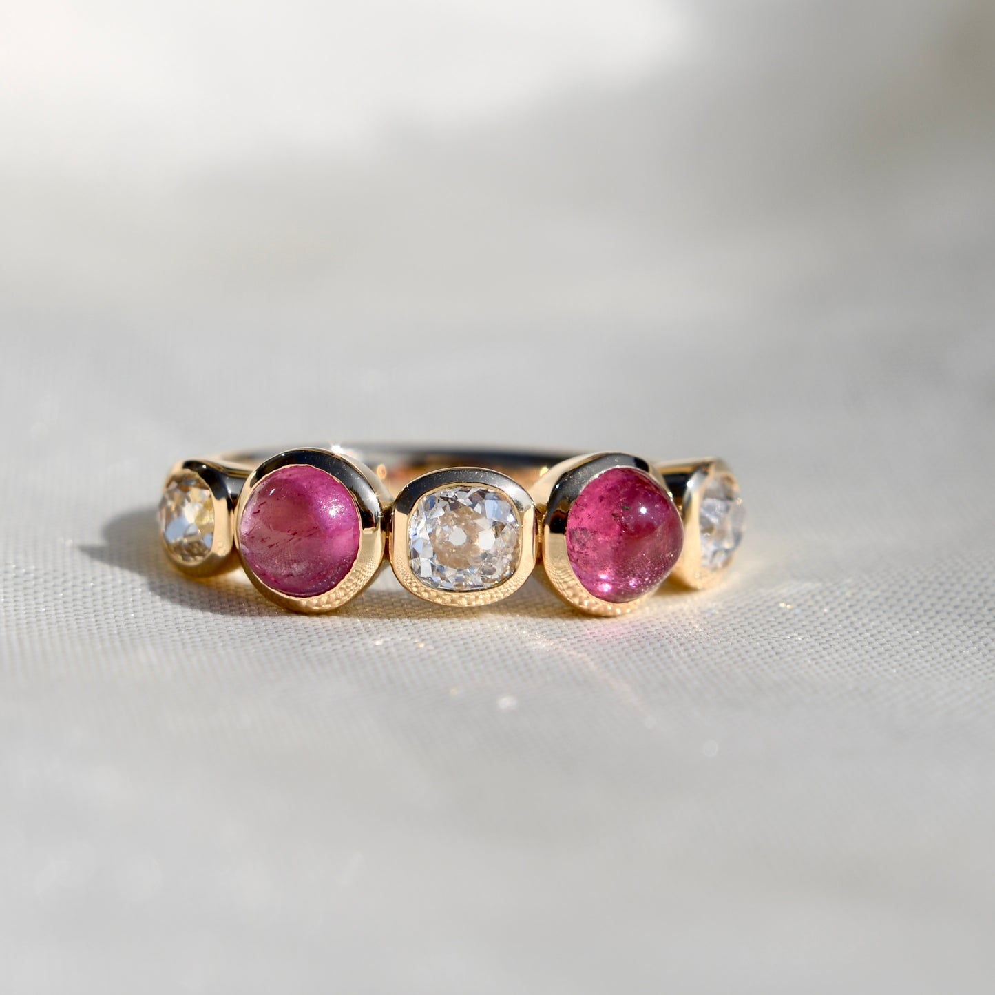0.96 ct old mine cut diamond and tourmaline five stone ring