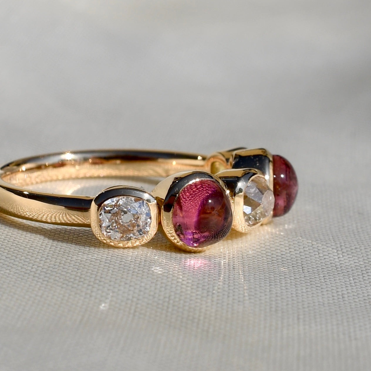 1.02 ct old mine cut diamond and tourmaline five stone ring