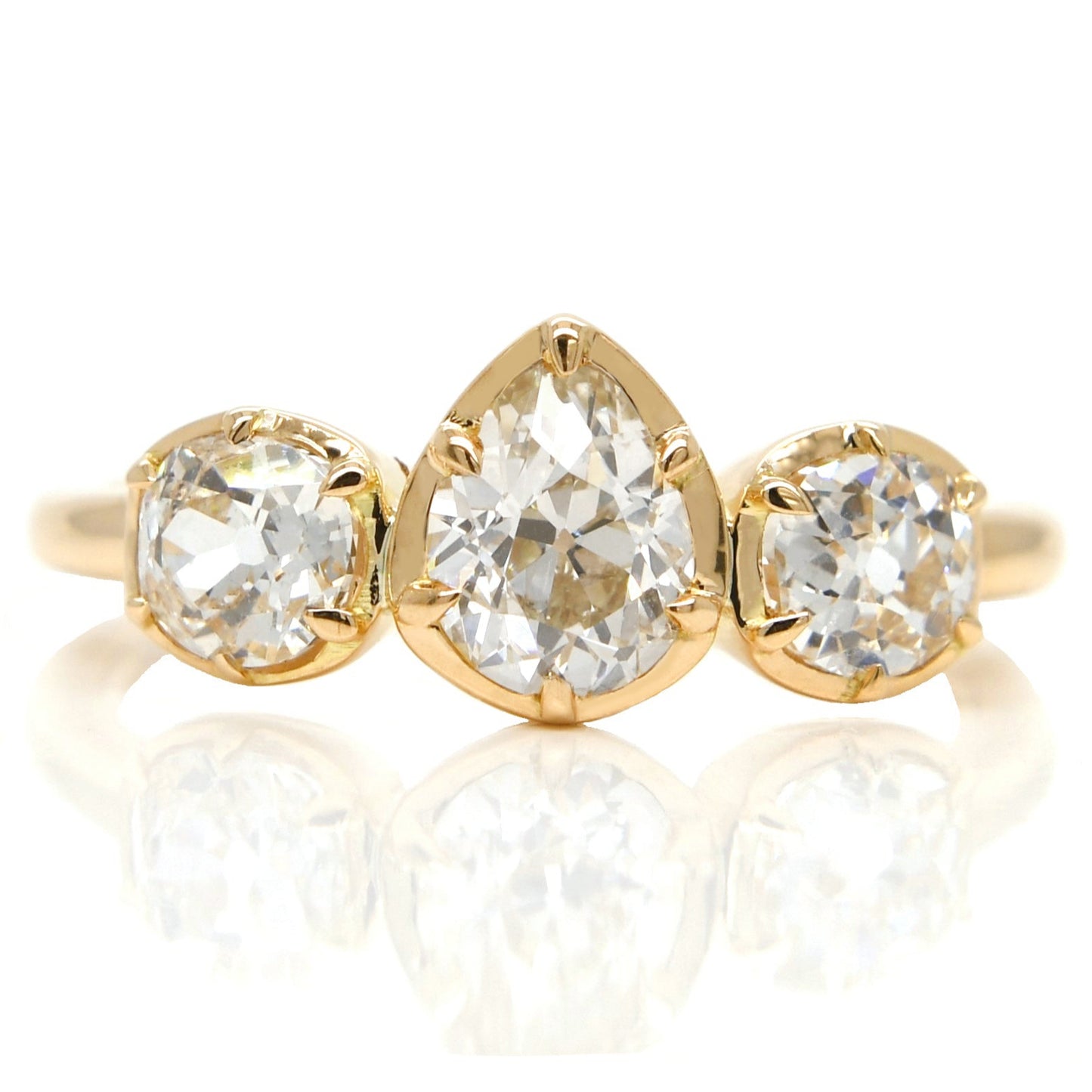 0.61 ct old pear and old mine cut diamond three stone ring