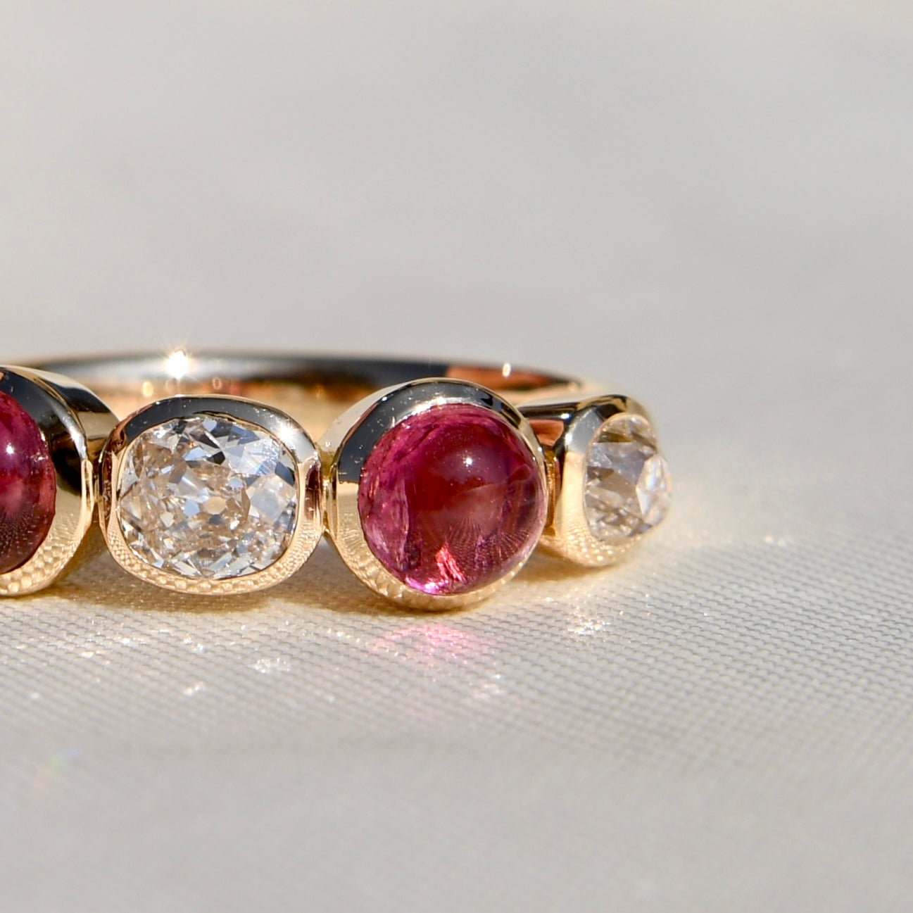 0.96 ct old mine cut diamond and tourmaline five stone ring