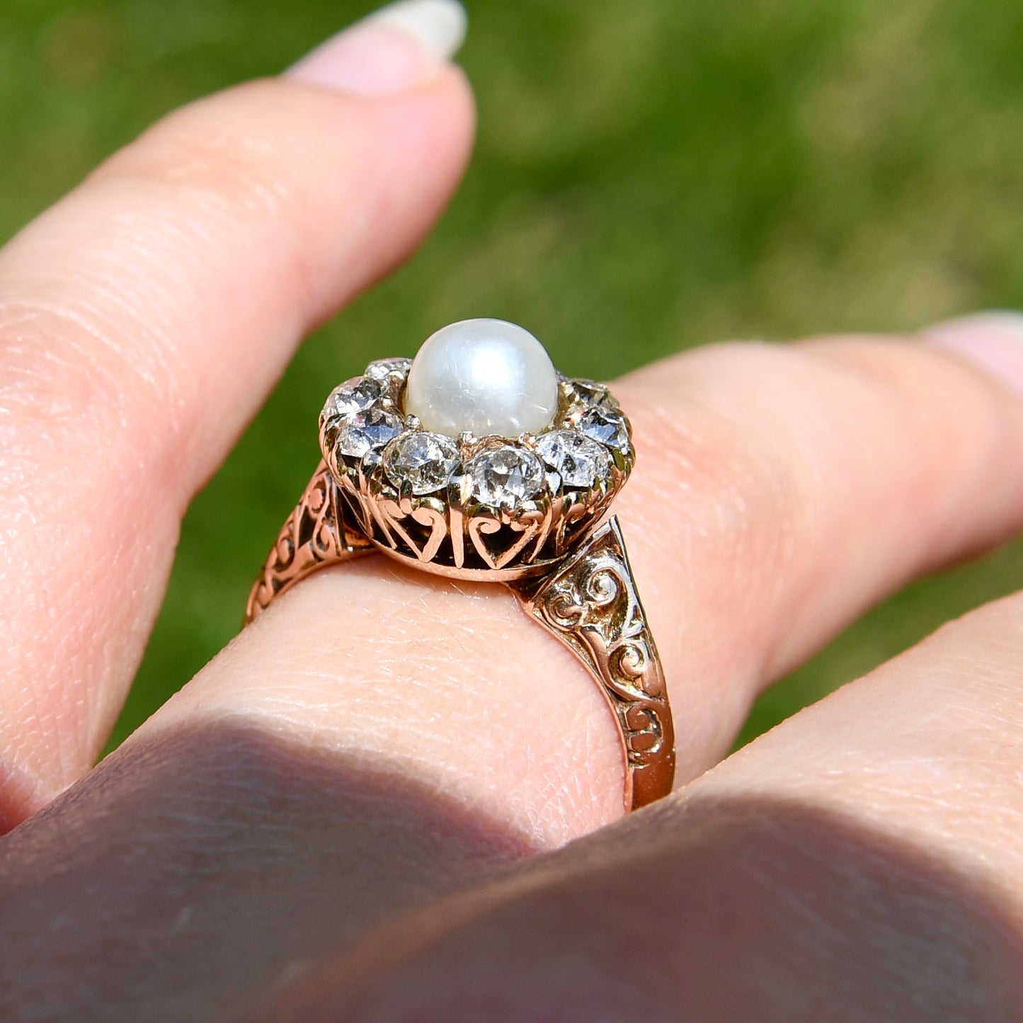 Antique natural pearl and 1.20 ct old mine cut diamond daisy ring