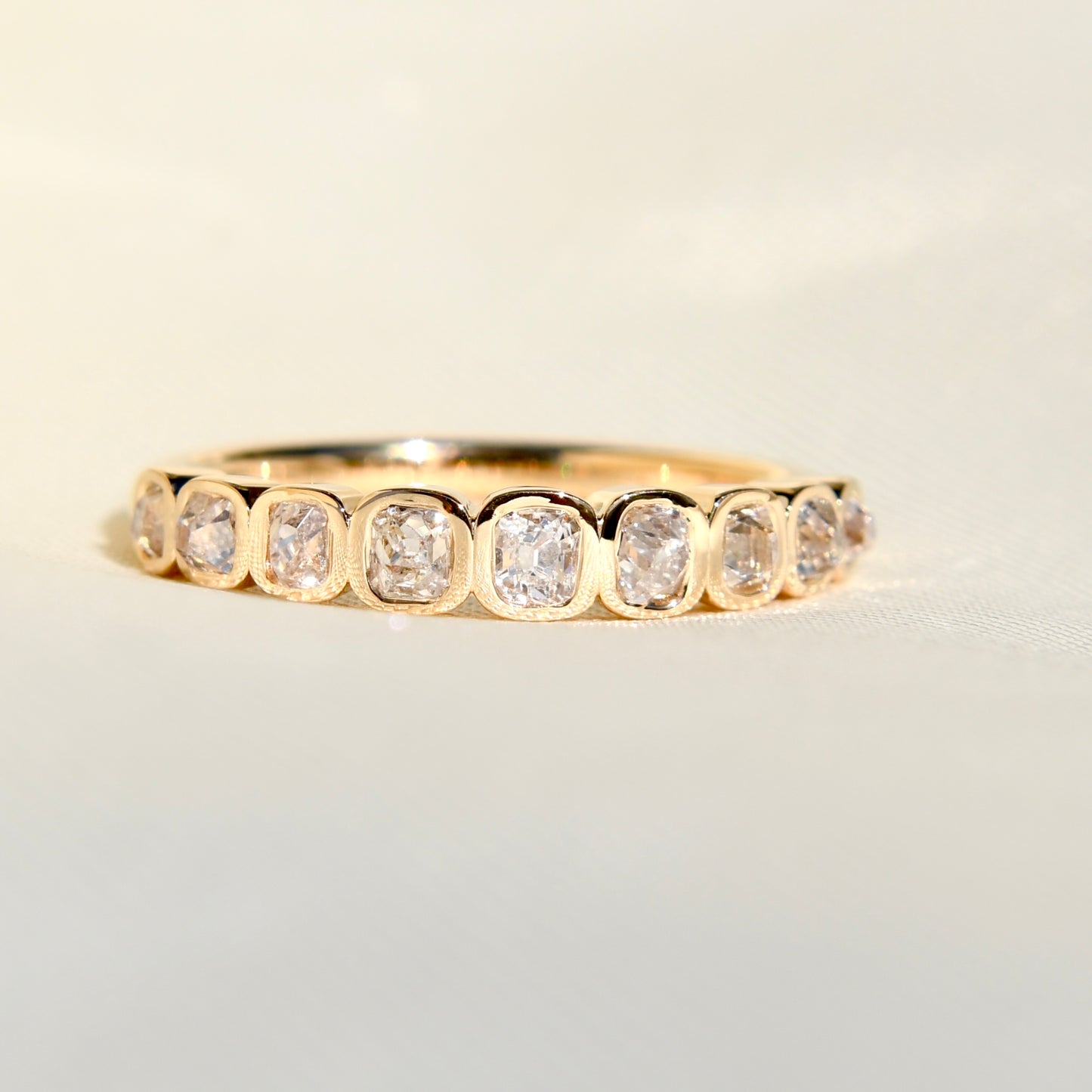 0.67 ct peruzzi cut diamond nine stone band ring