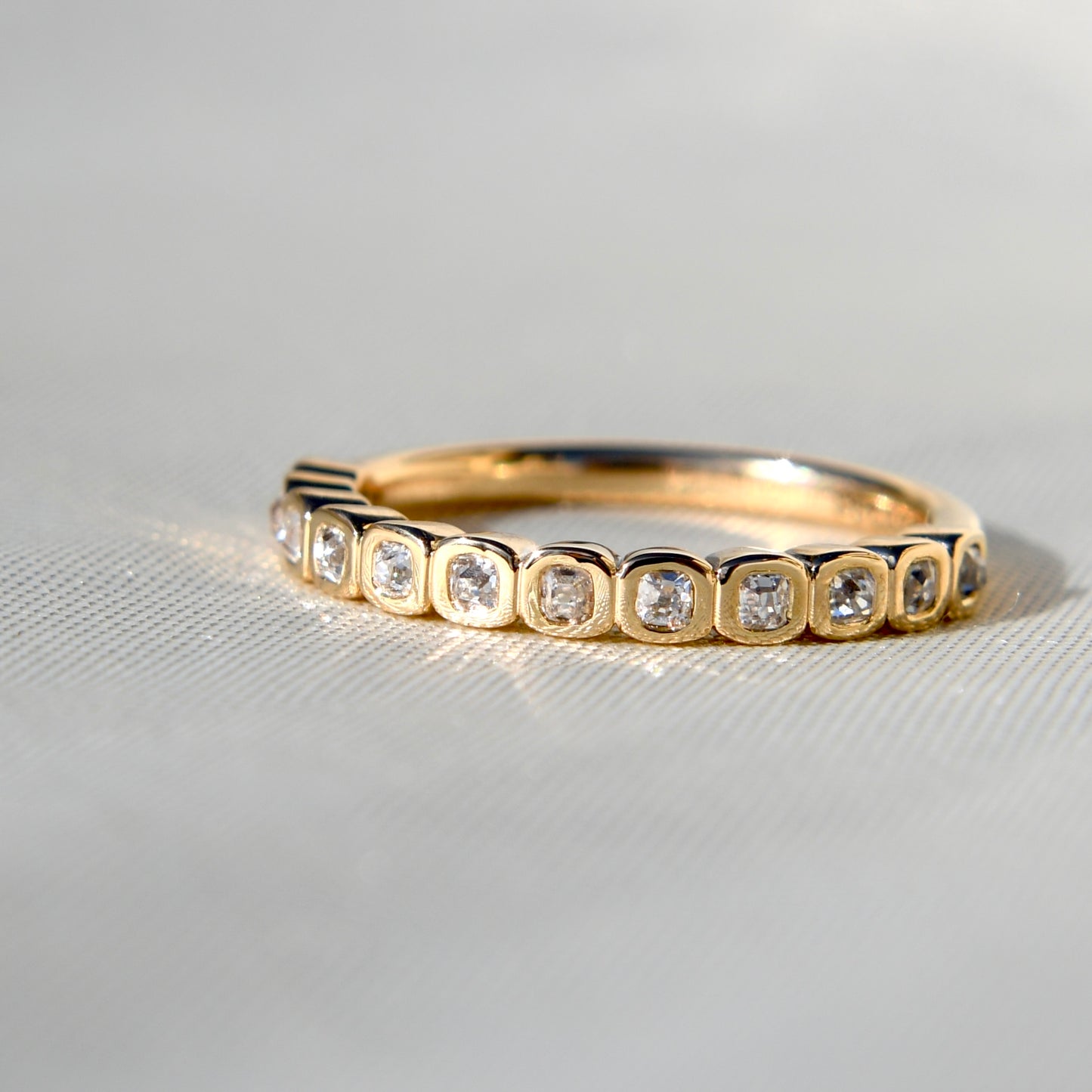 0.24 ct peruzzi cut diamond twelve stone band ring