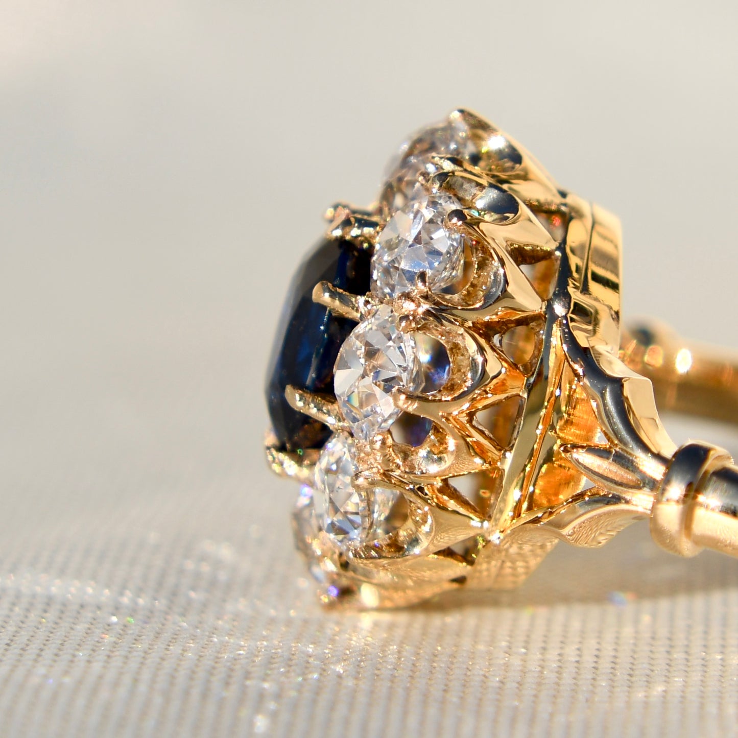 1.15 ct sapphire and old mine cut diamond cluster ring