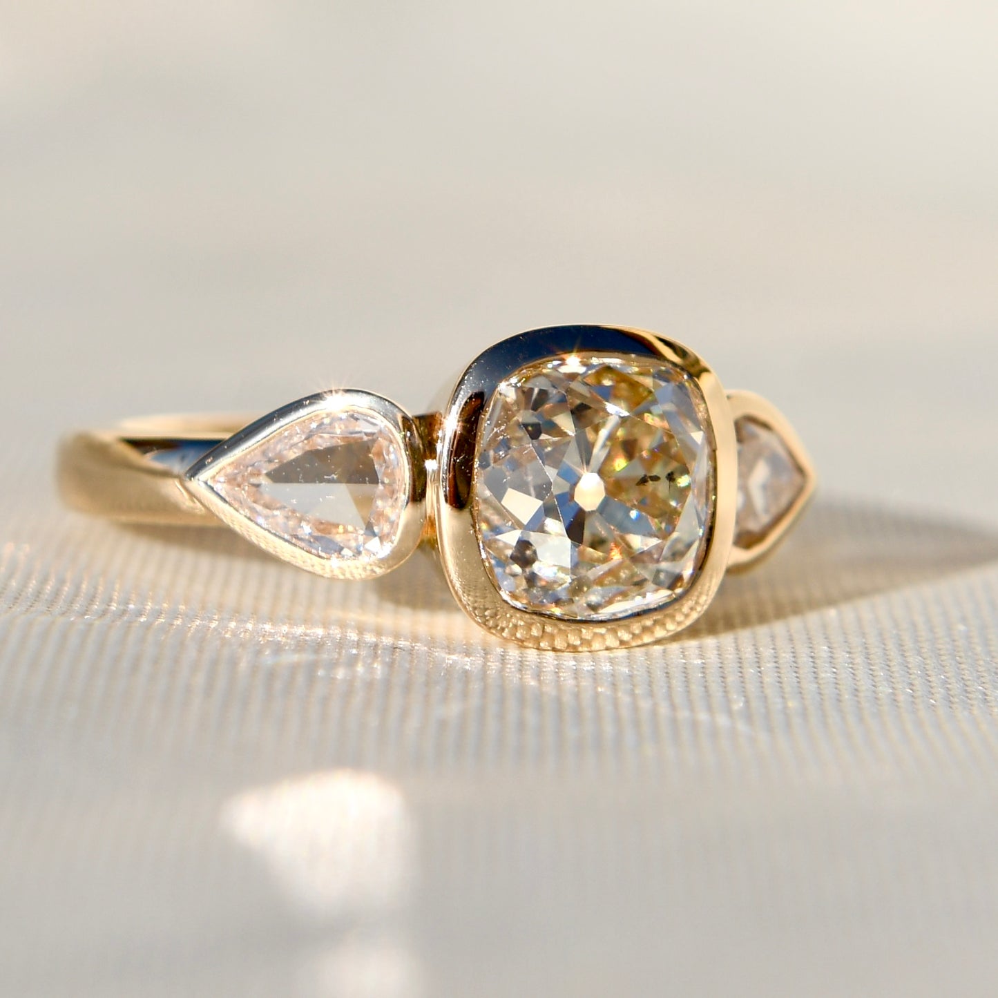 1.78 ct old mine and pear rose cut diamond three stone ring