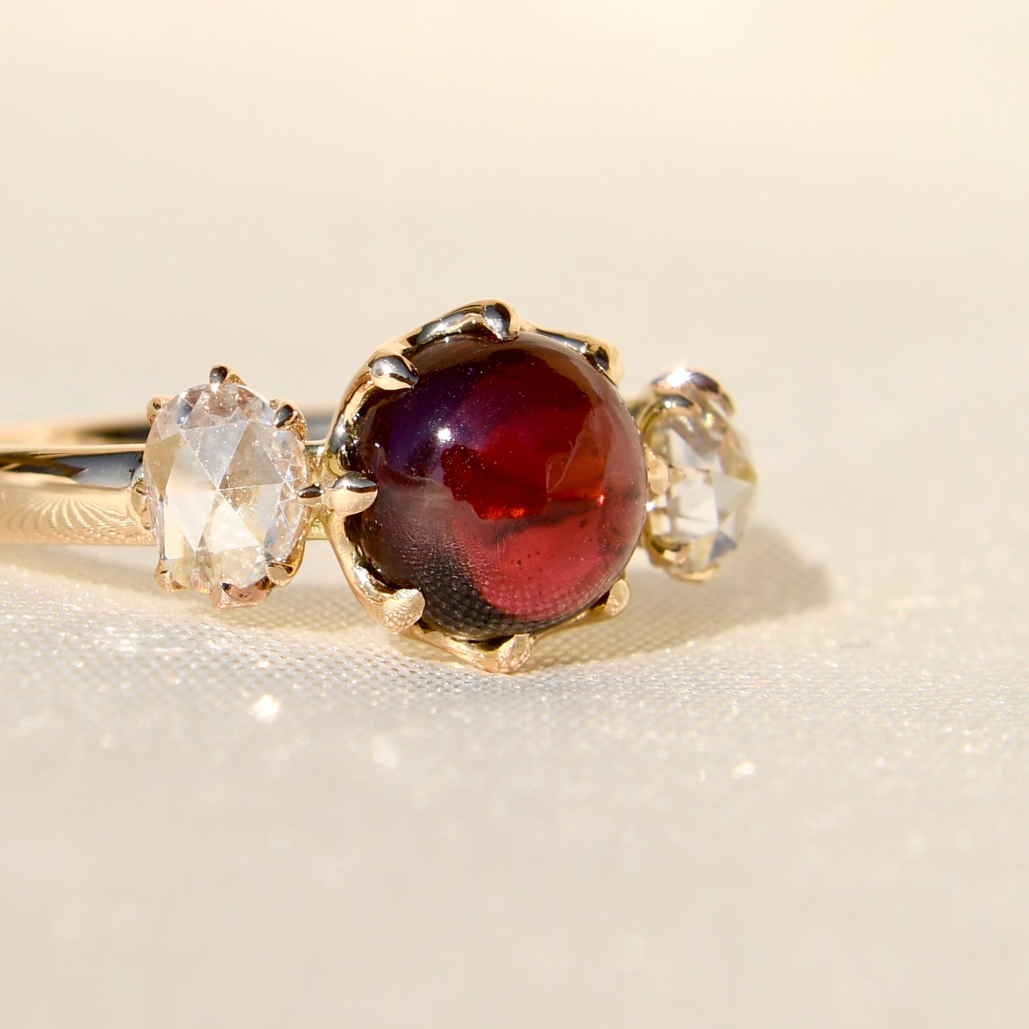 2.15 ct tourmaline cabochon and rose cut diamond three stone ring