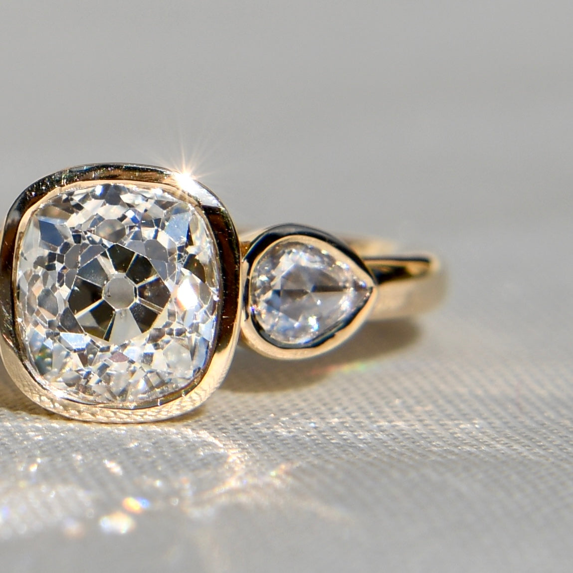 1.19 ct old mine and pear rose cut diamond three stone ring