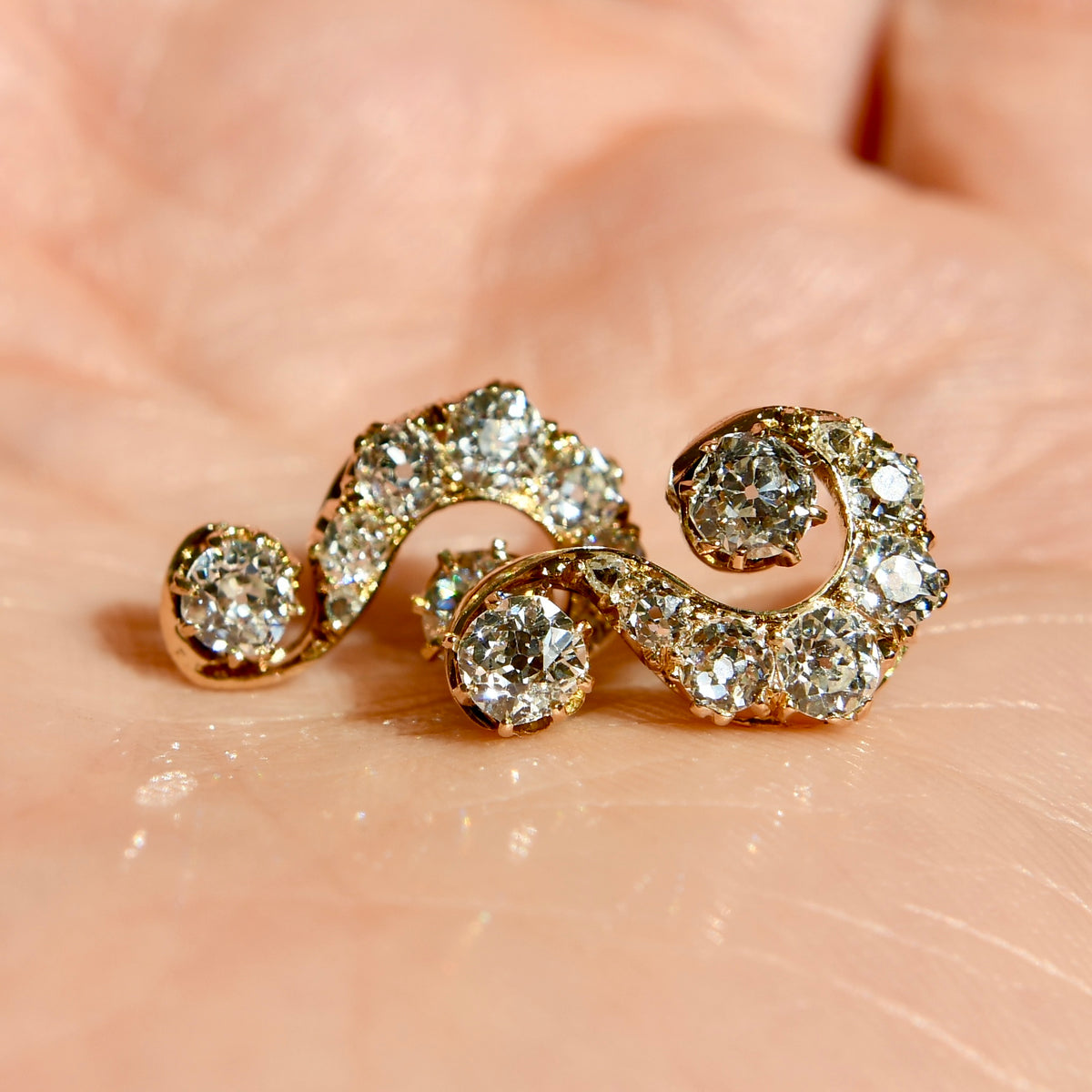 1.46 ct old mine cut diamond swirl stud earrings