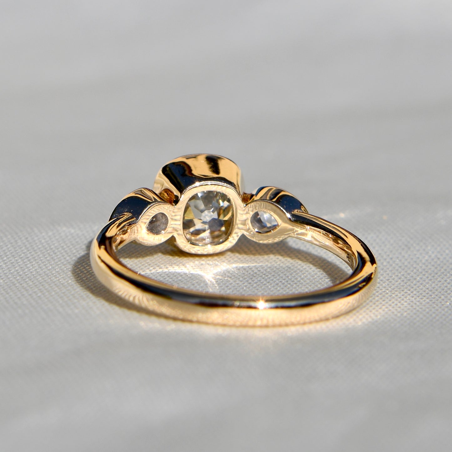 1.19 ct old mine and pear rose cut diamond three stone ring