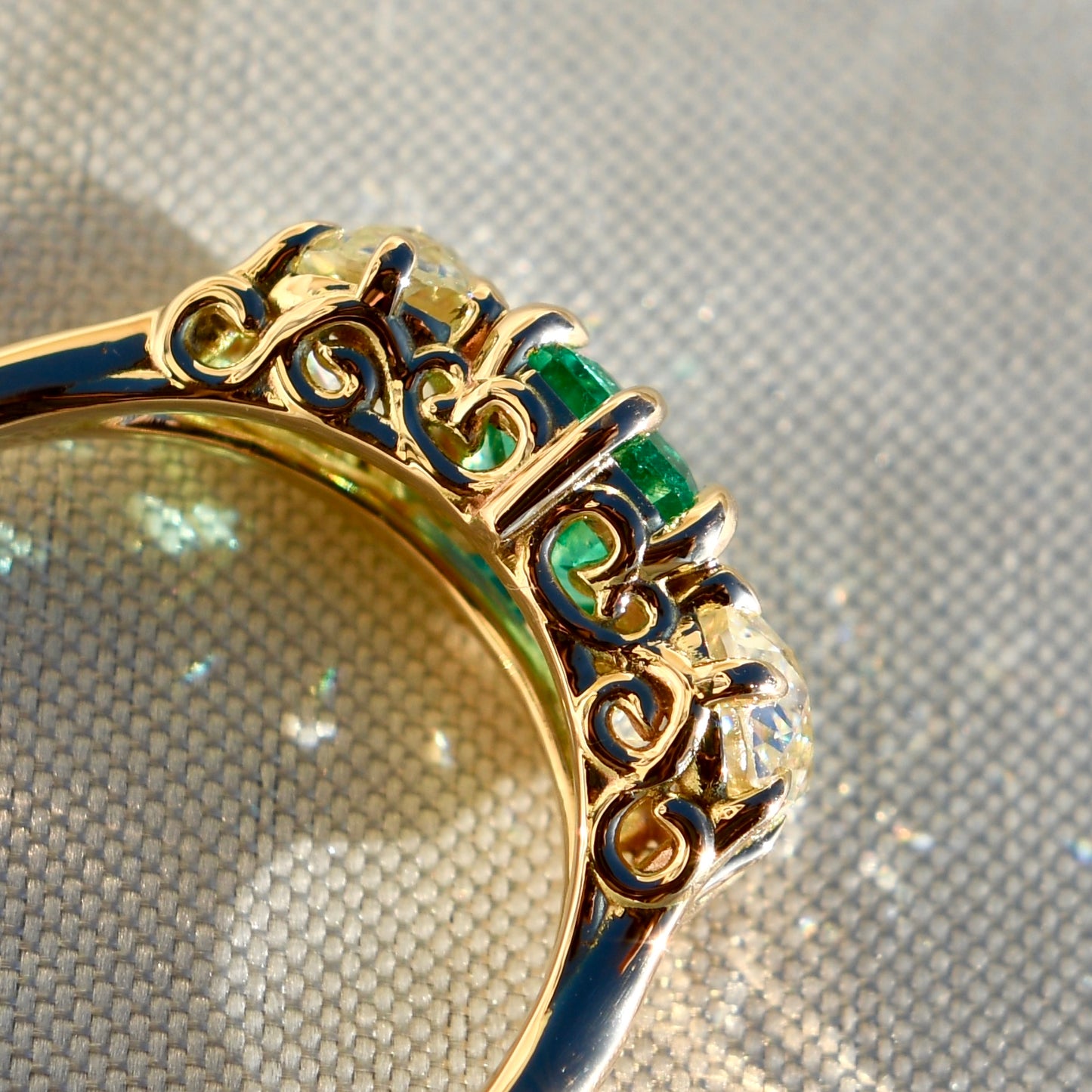 0.95 ct Colombian emerald and old mine cut diamond three stone ring