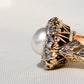Antique natural pearl and 1.20 ct old mine cut diamond daisy ring