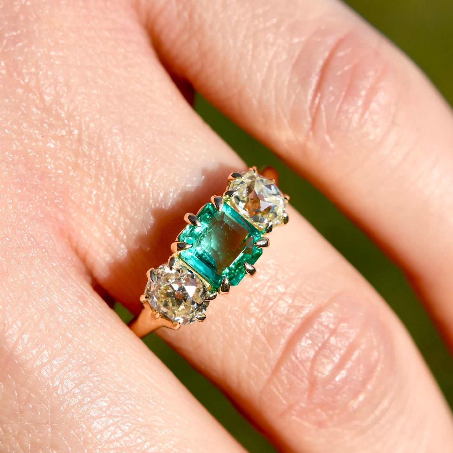0.95 ct Colombian emerald and old mine cut diamond three stone ring