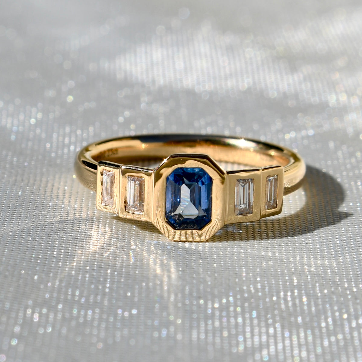0.61 ct Ceylon sapphire and baguette cut diamond five stone ring