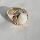 Antique opal and old mine cut diamond halo ring