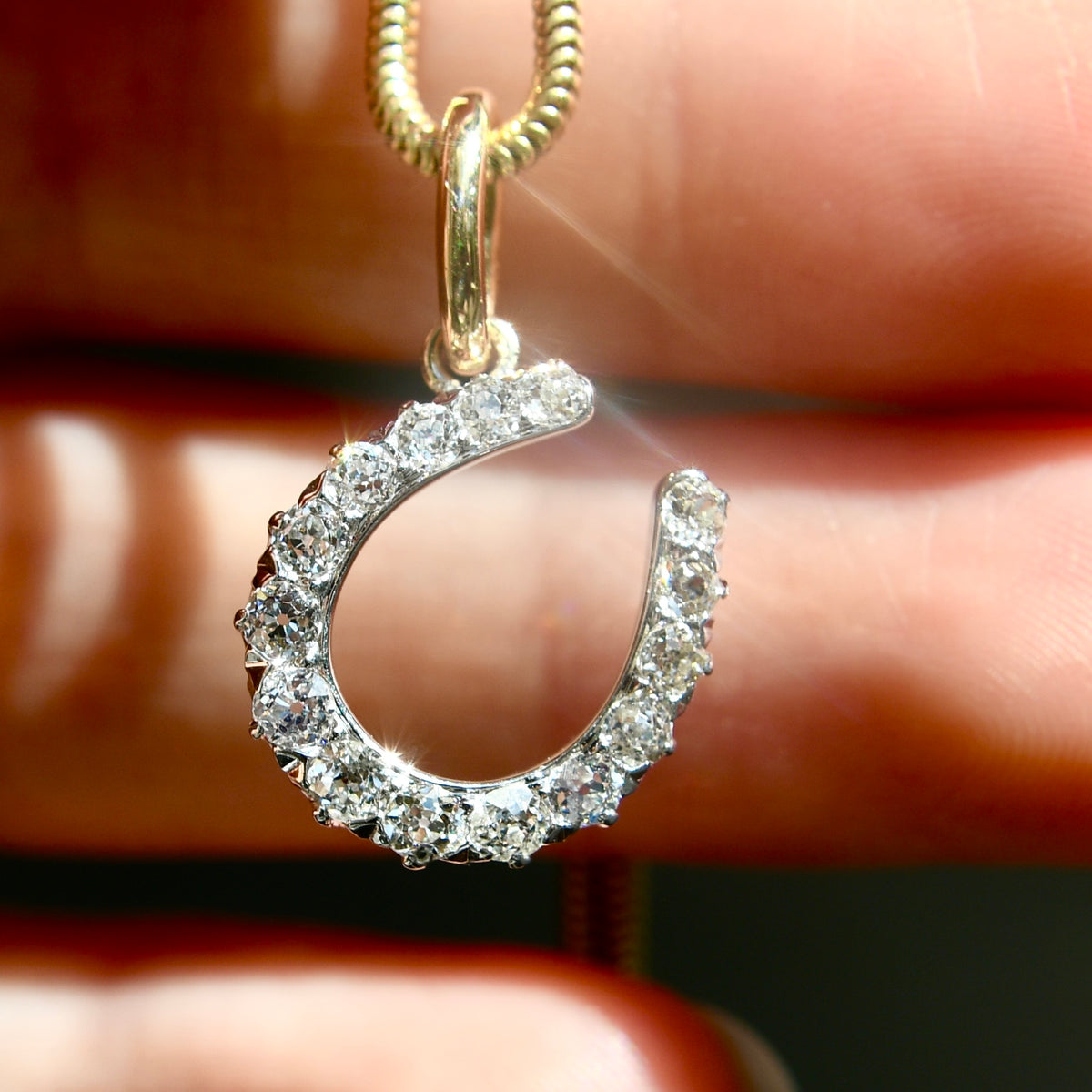 Antique 0.60 ct old European cut diamond horseshoe pendant