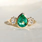 1.34 ct Colombian pear cut emerald and old mine cut diamond three stone ring