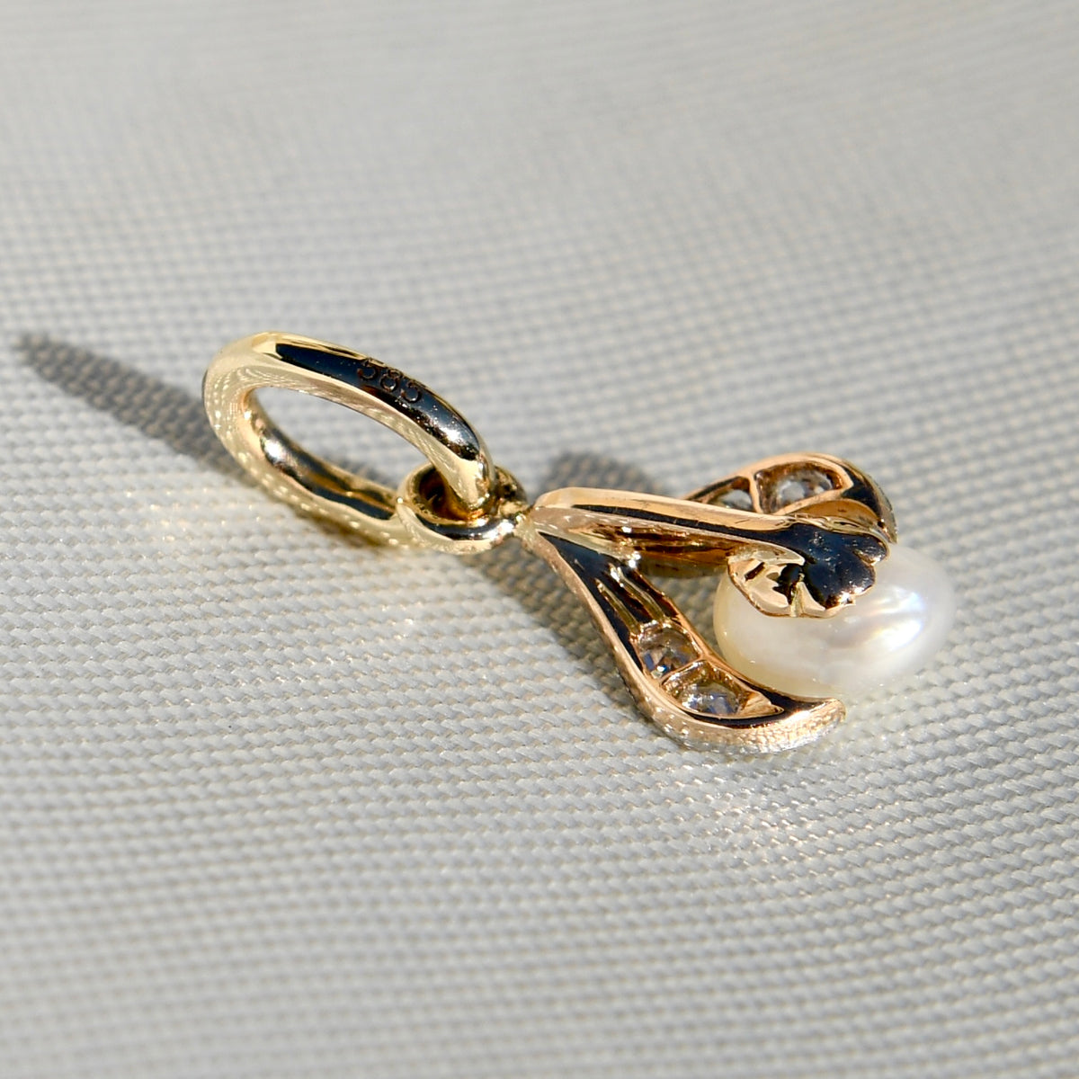 Natural saltwater pearl and diamond tulip pendant