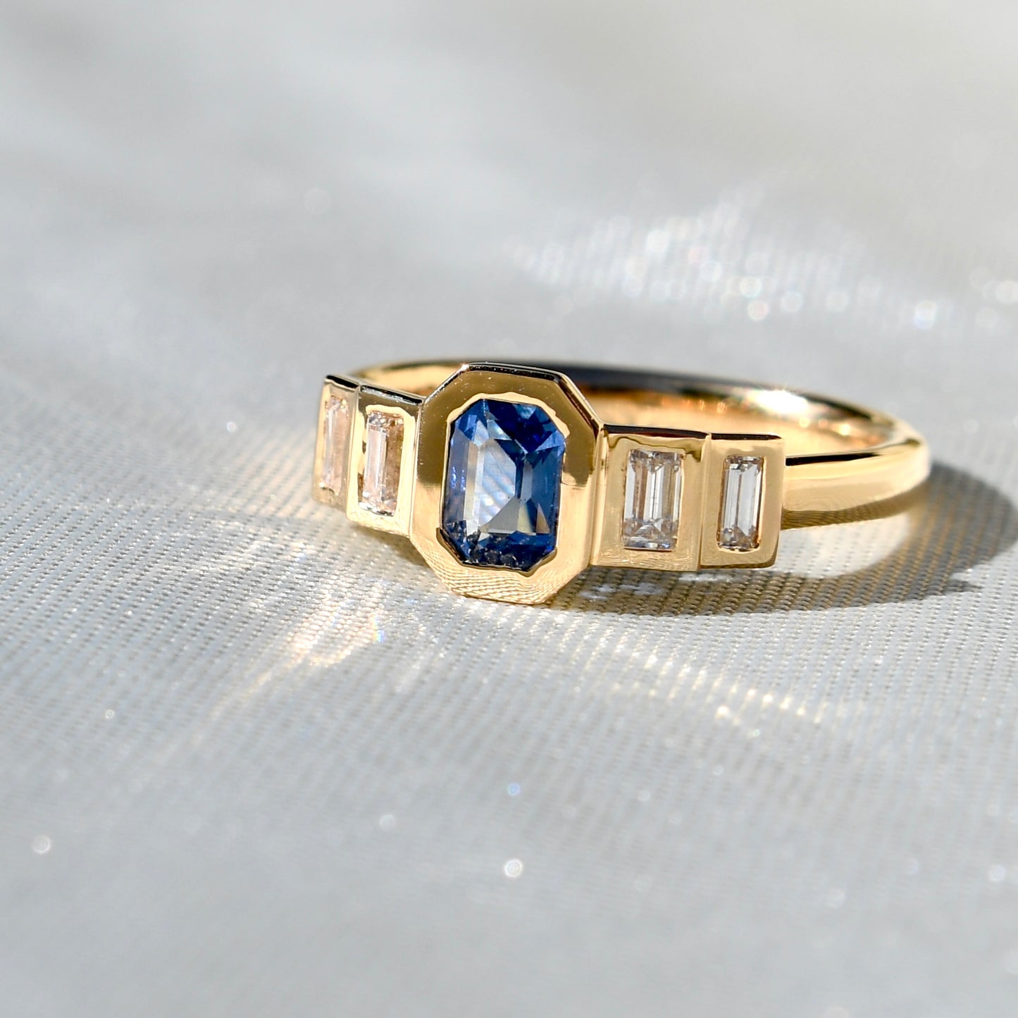 0.61 ct Ceylon sapphire and baguette cut diamond five stone ring