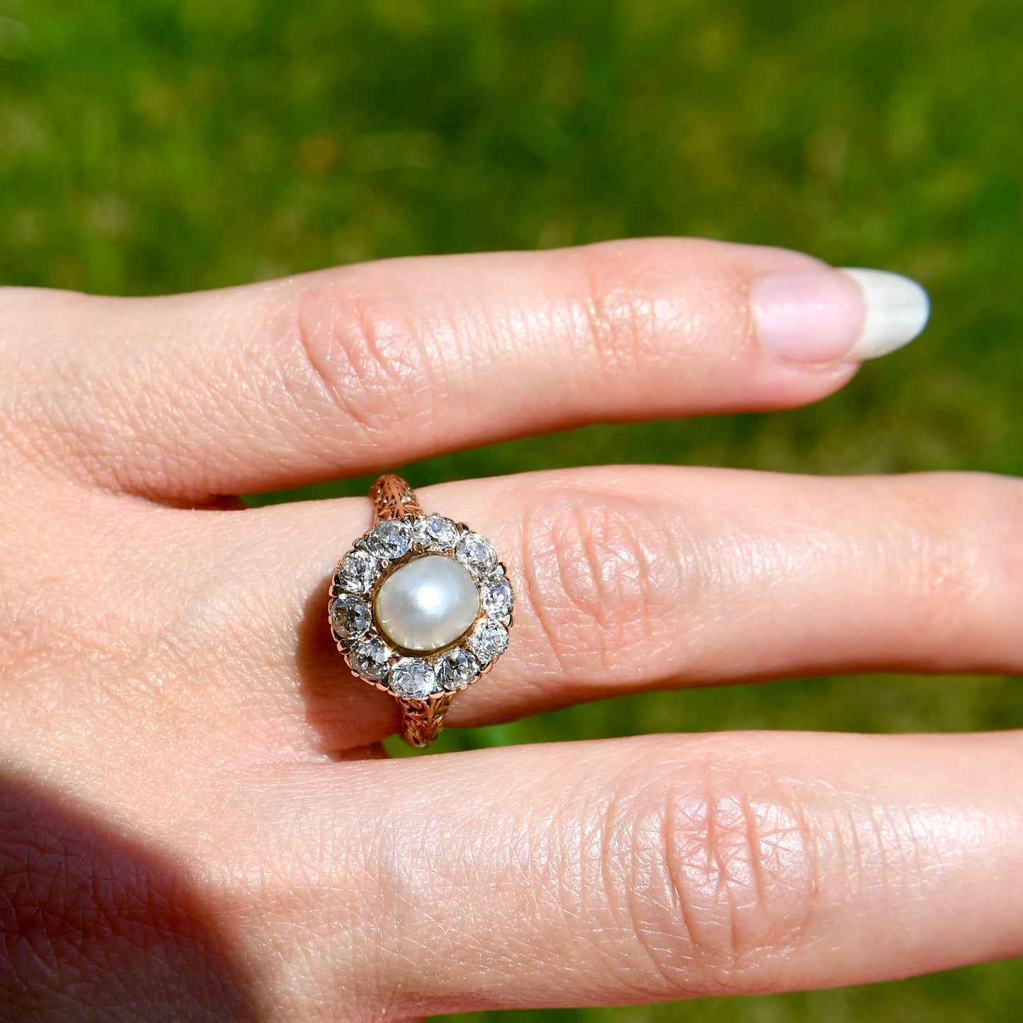 Antique natural pearl and 1.20 ct old mine cut diamond daisy ring