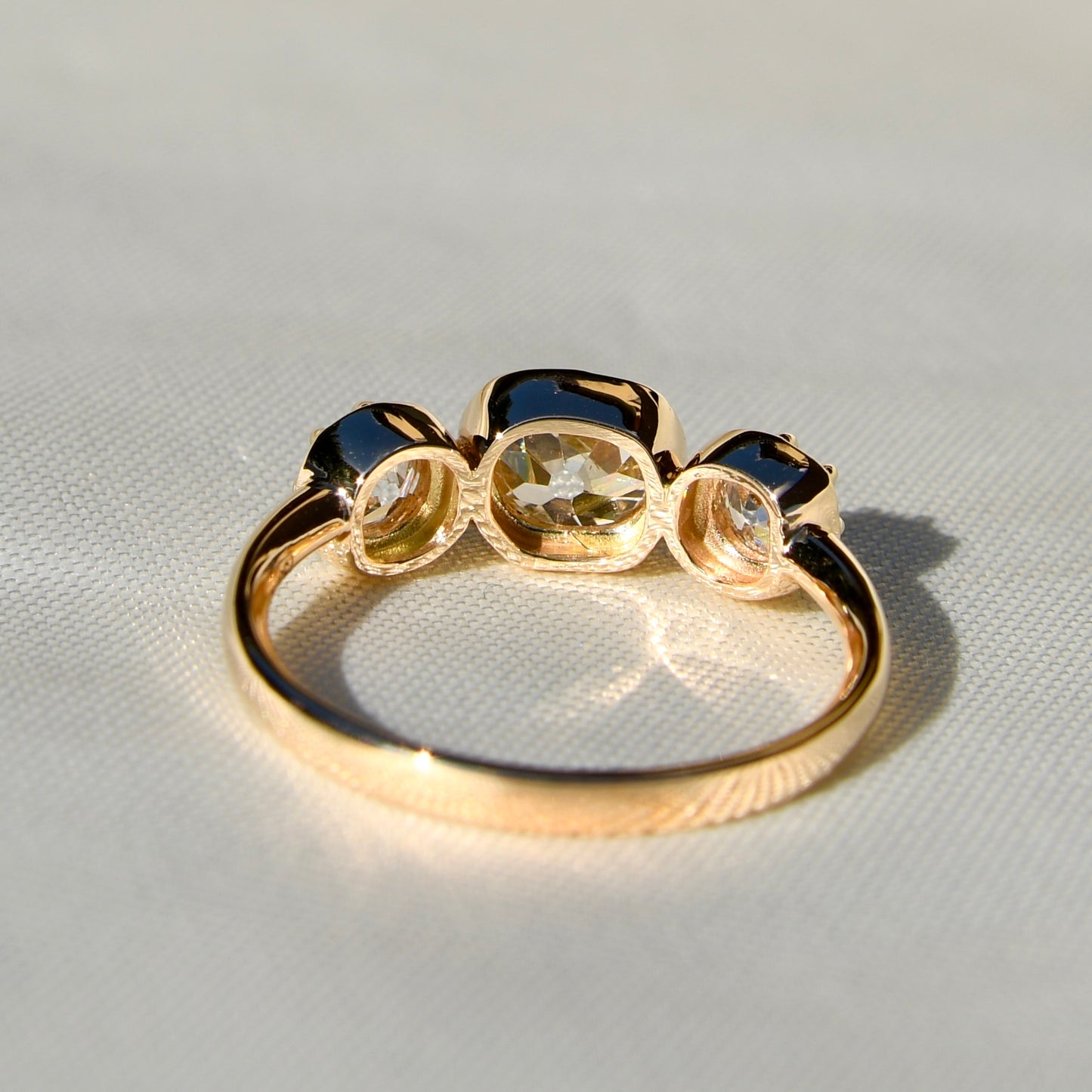 0.86 ct old mine cut diamond three stone ring