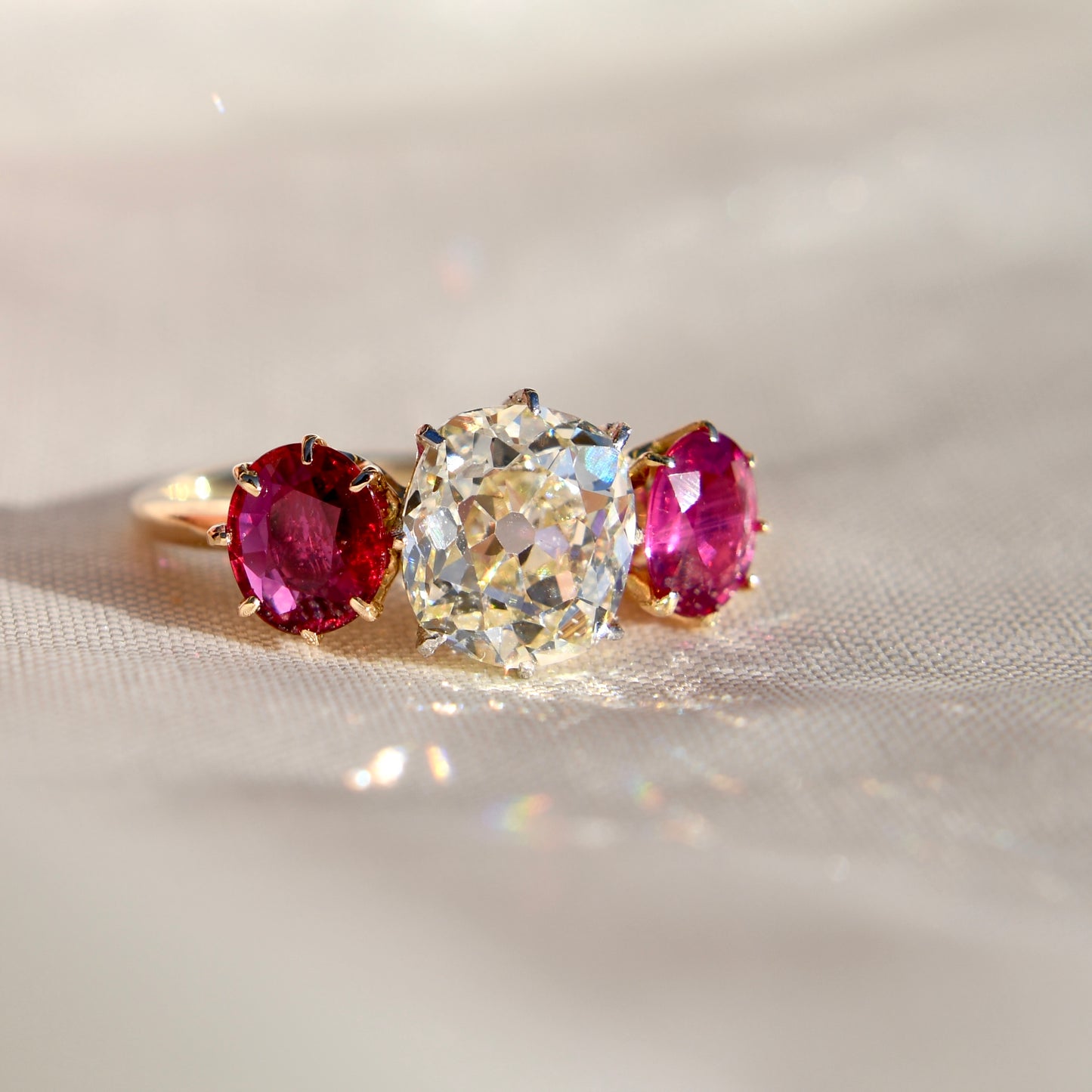 2.22 ct old mine cut diamond and ruby three stone ring