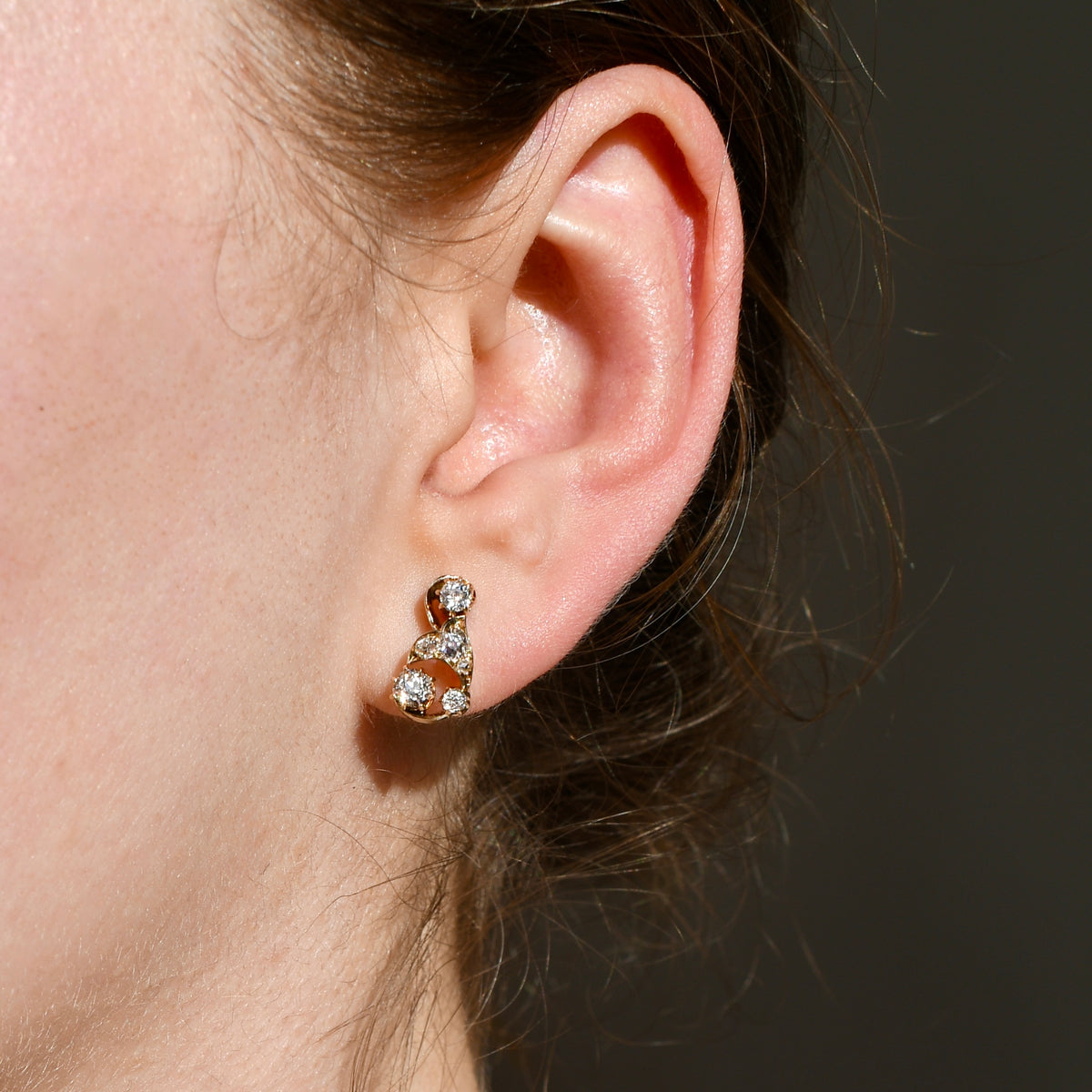 0.84 ct old mine cut diamond swirl stud earrings