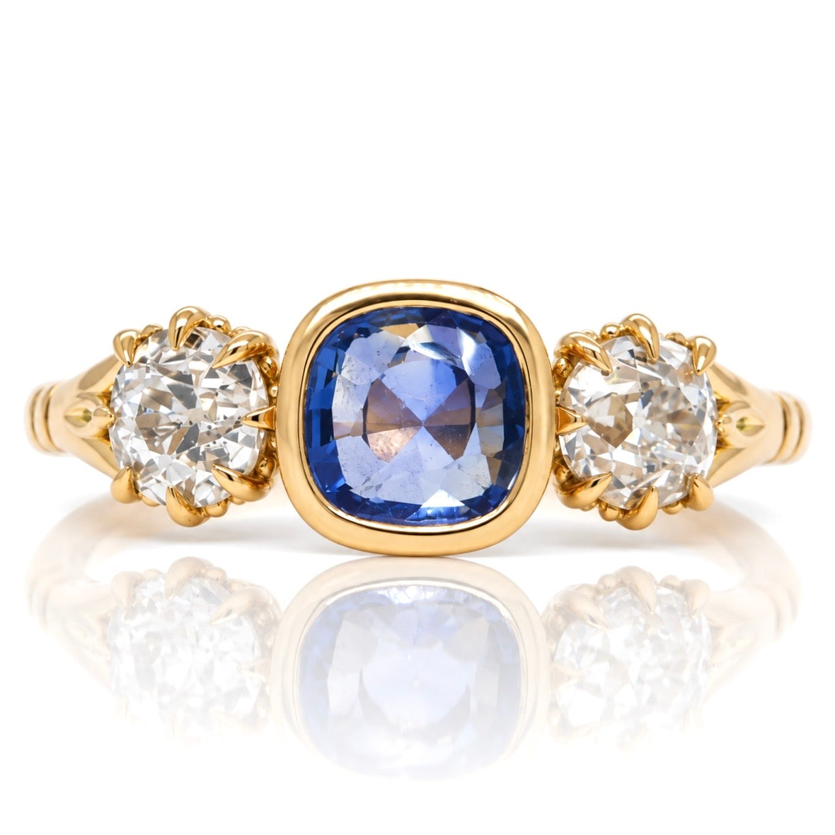 0.75 ct Ceylon sapphire and old mine cut diamond three stone ring