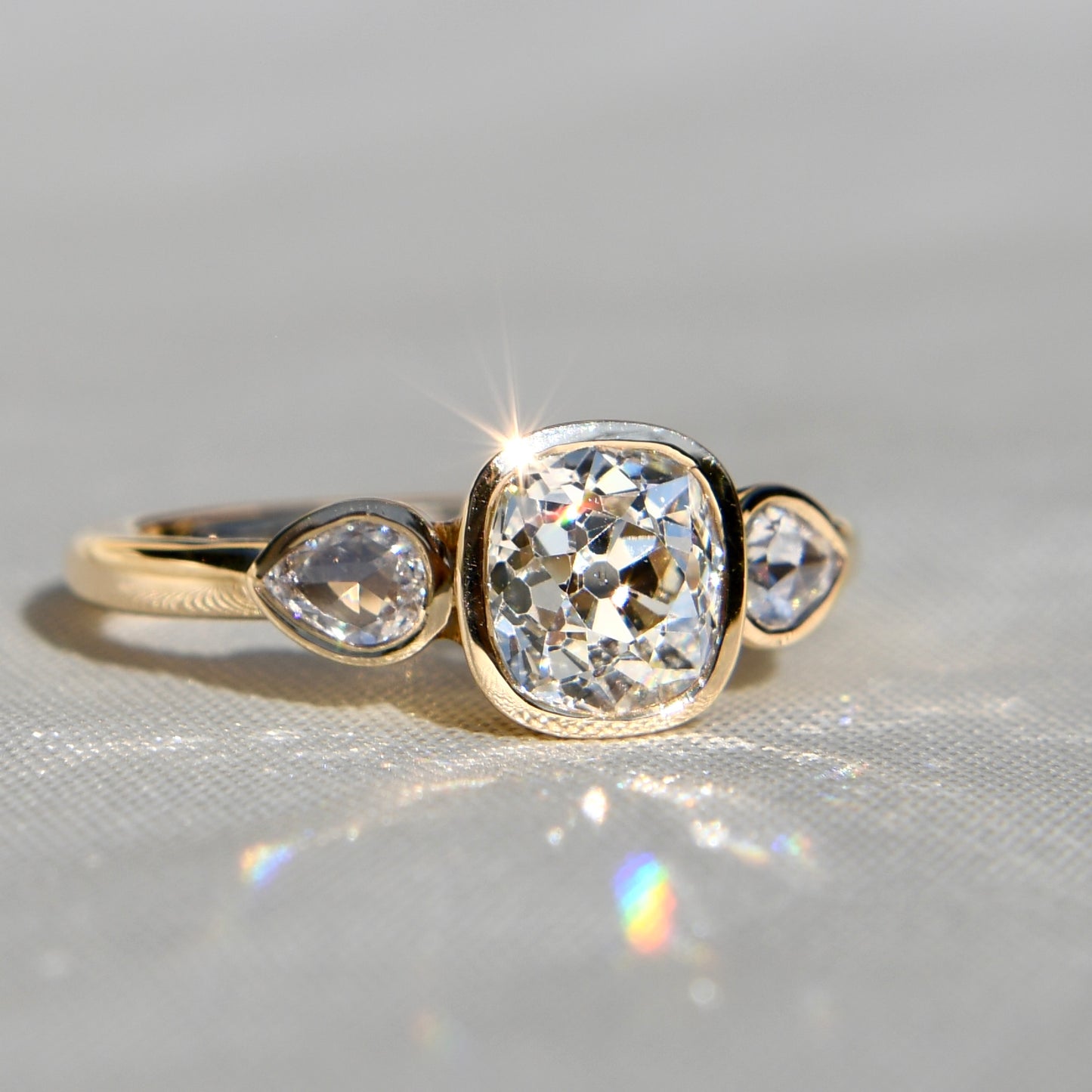 1.19 ct old mine and pear rose cut diamond three stone ring