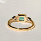 0.69 ct Colombian emerald and old pear cut diamond three stone ring