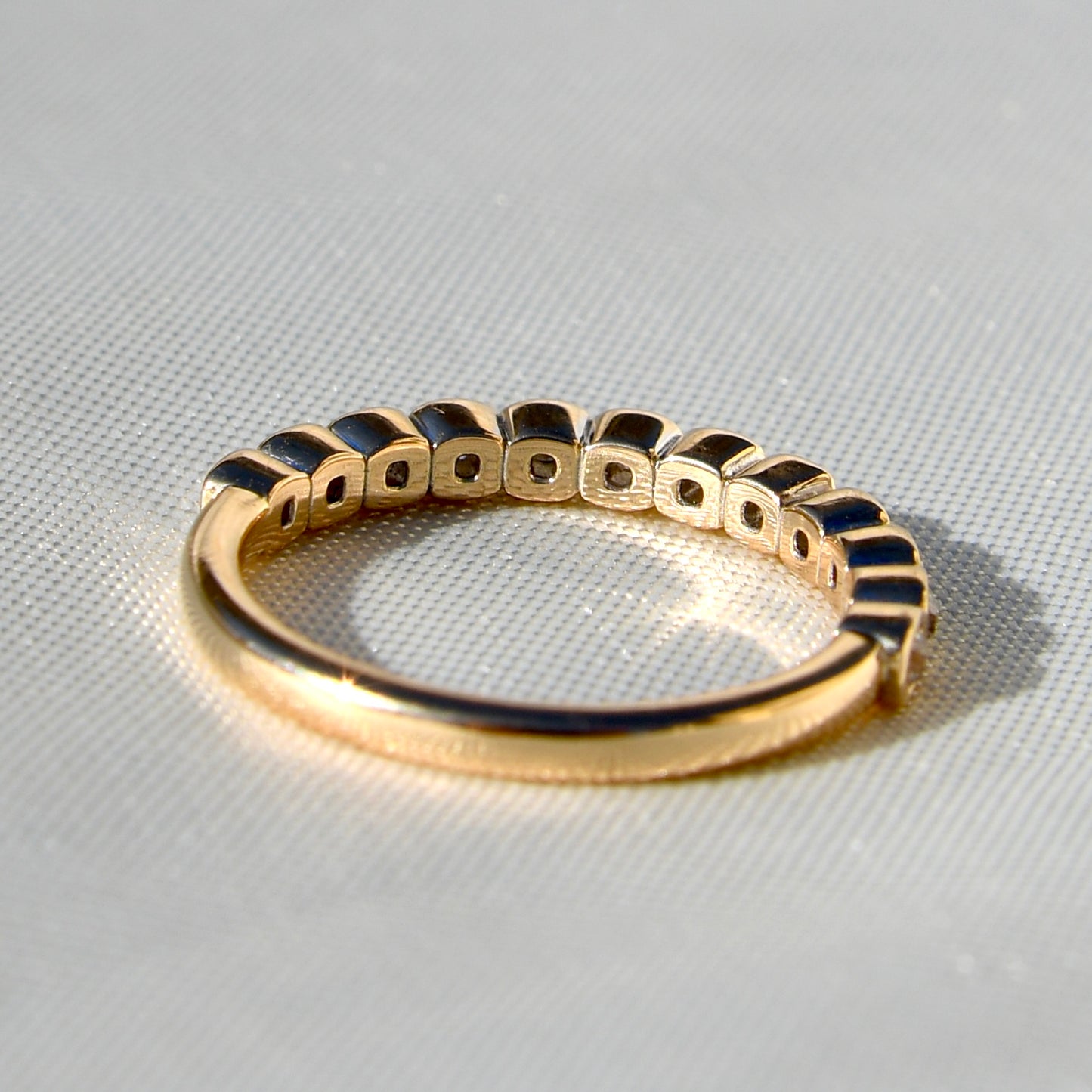 0.24 ct peruzzi cut diamond twelve stone band ring