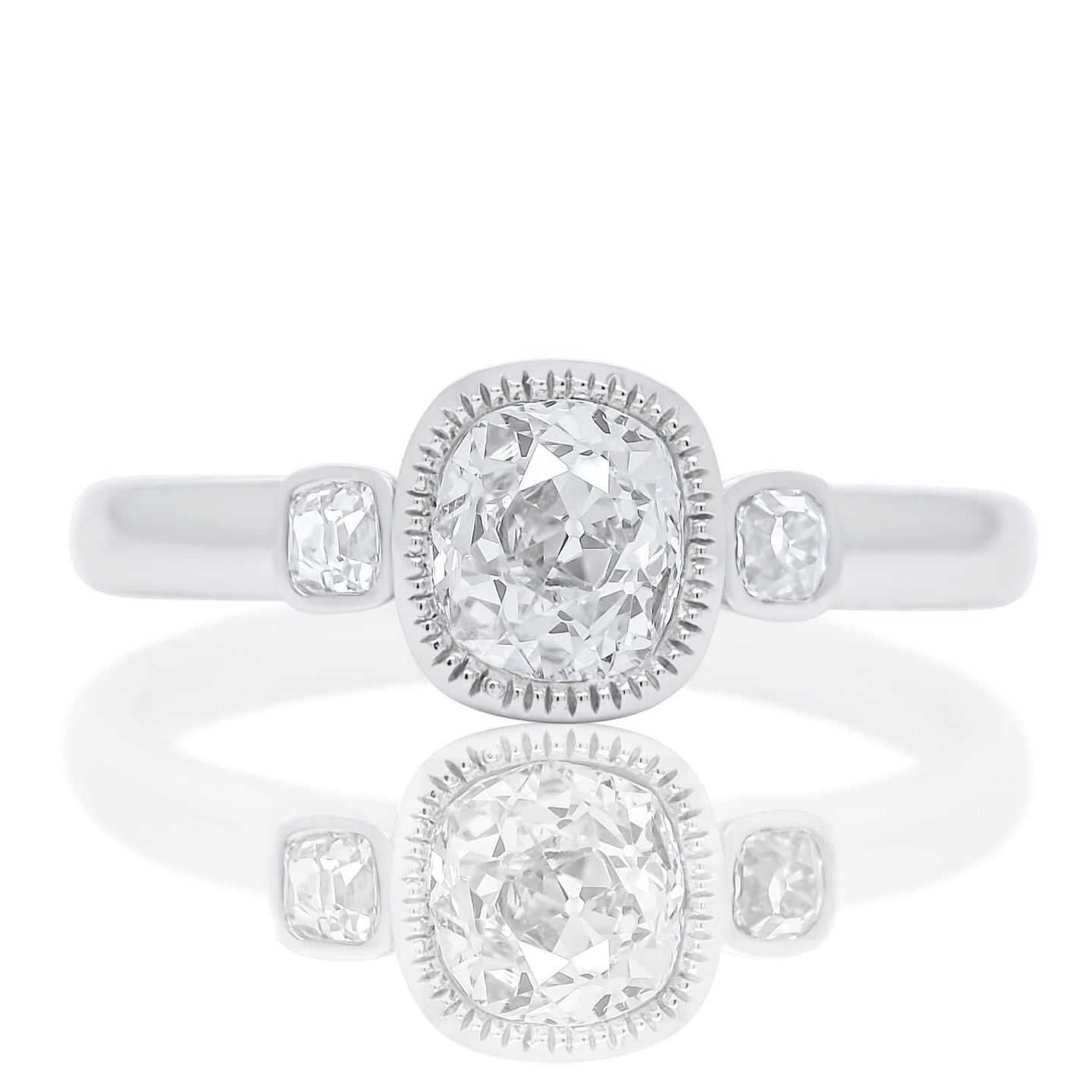 0.60 ct old mine and peruzzi cut diamond three stone ring