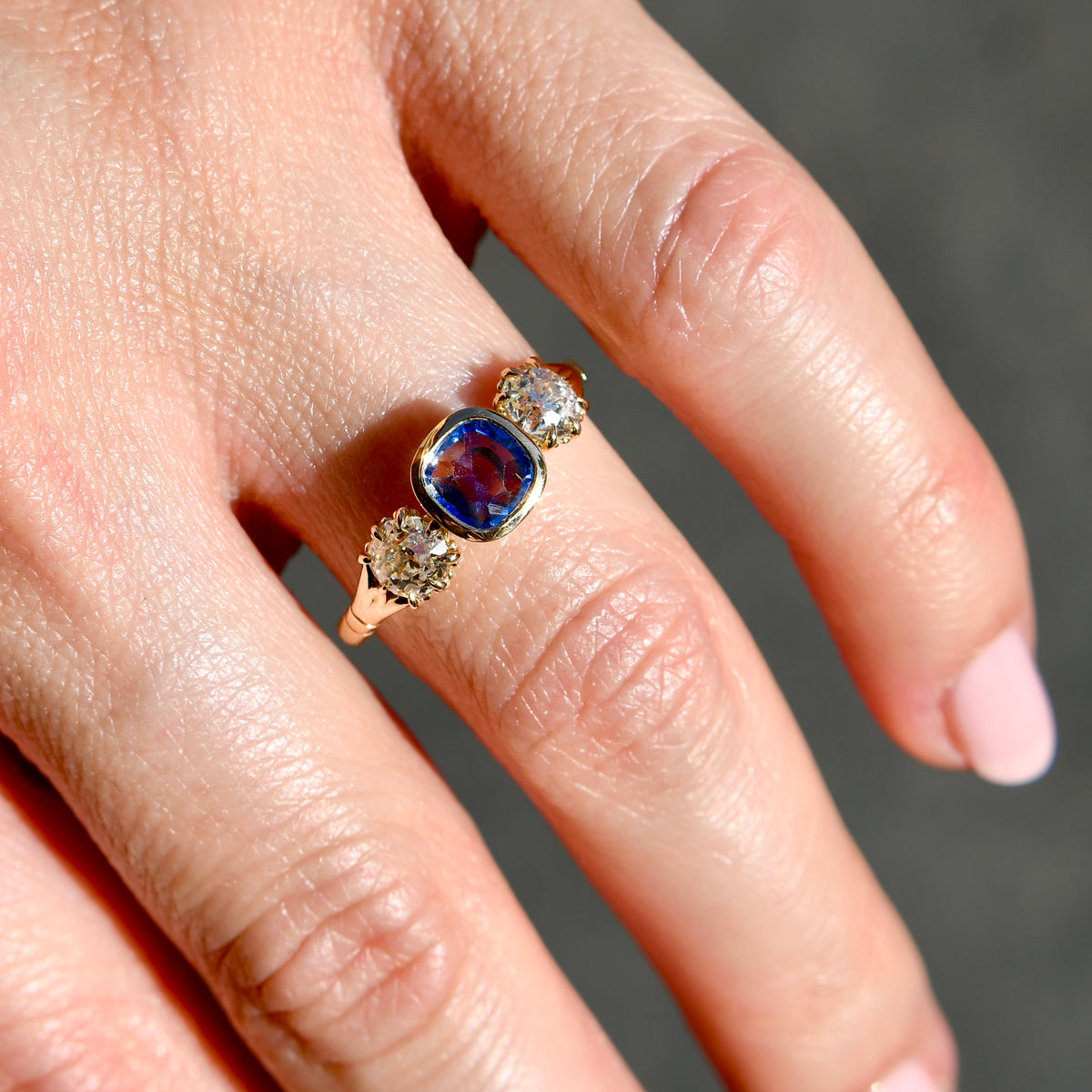 0.75 ct Ceylon sapphire and old mine cut diamond three stone ring