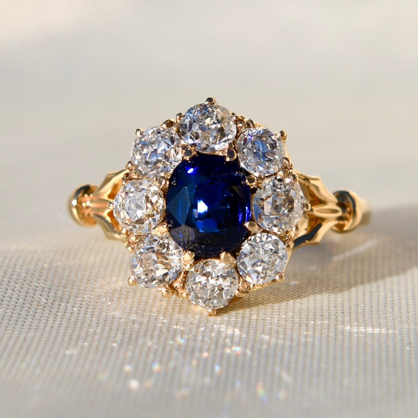 1.15 ct sapphire and old mine cut diamond cluster ring