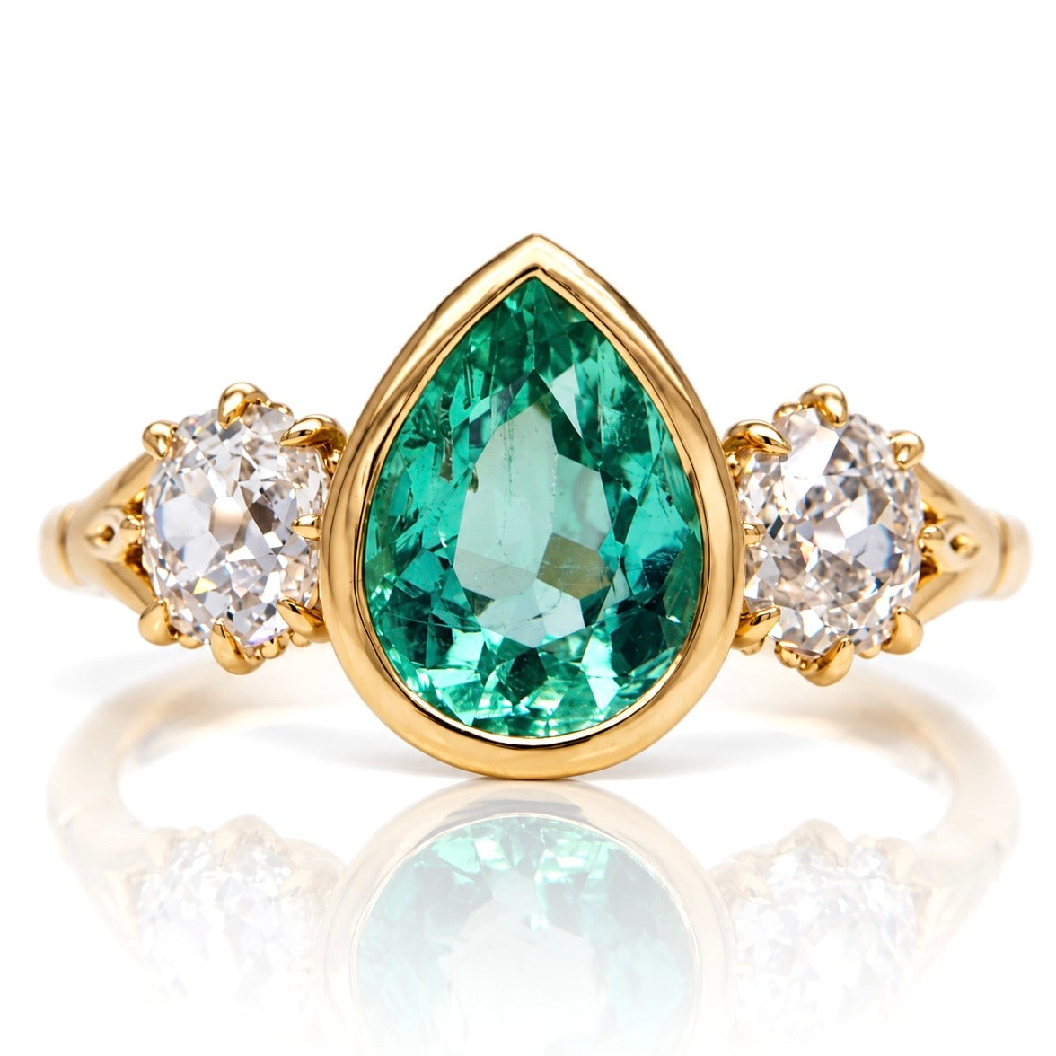 1.34 ct Colombian pear cut emerald and old mine cut diamond three stone ring