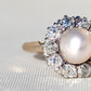Antique natural pearl and 1.30 ct old mine cut diamond daisy ring