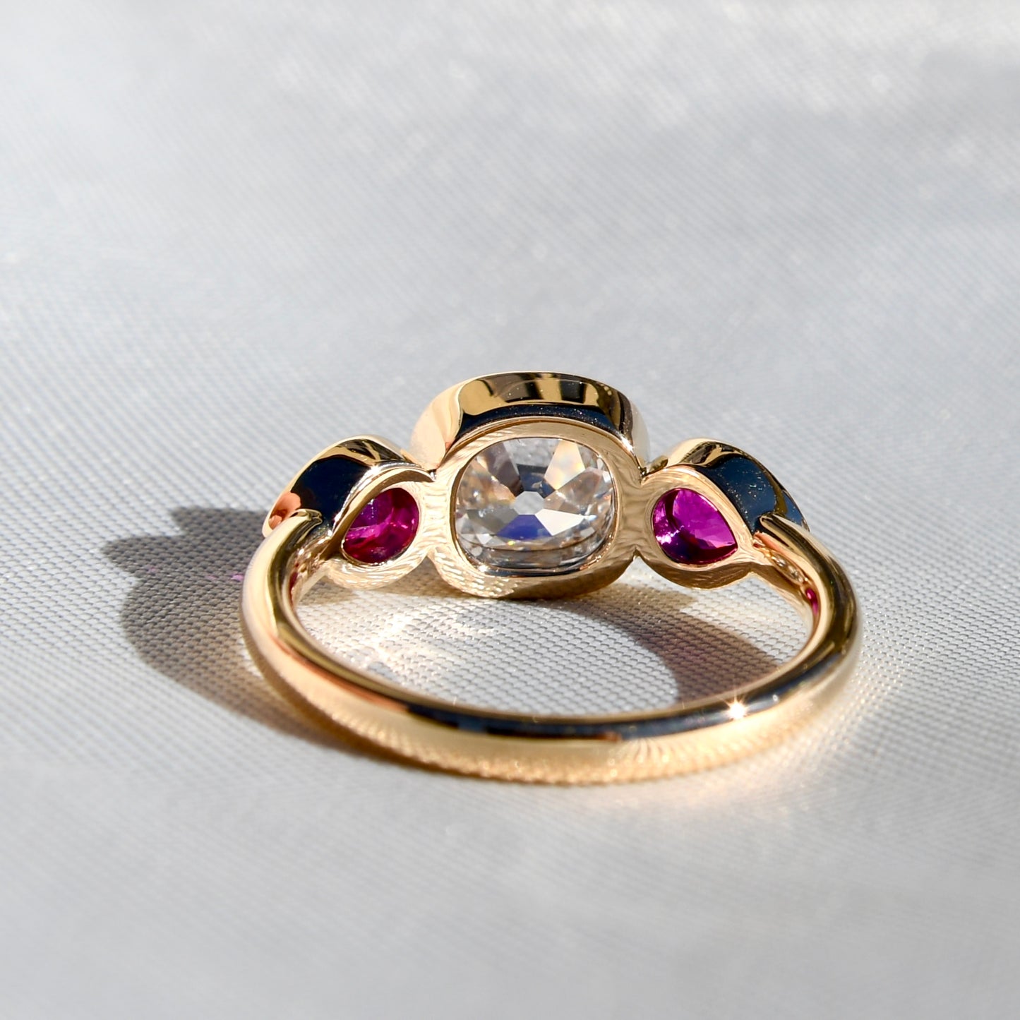 1.18 ct old mine cut diamond and ruby three stone ring