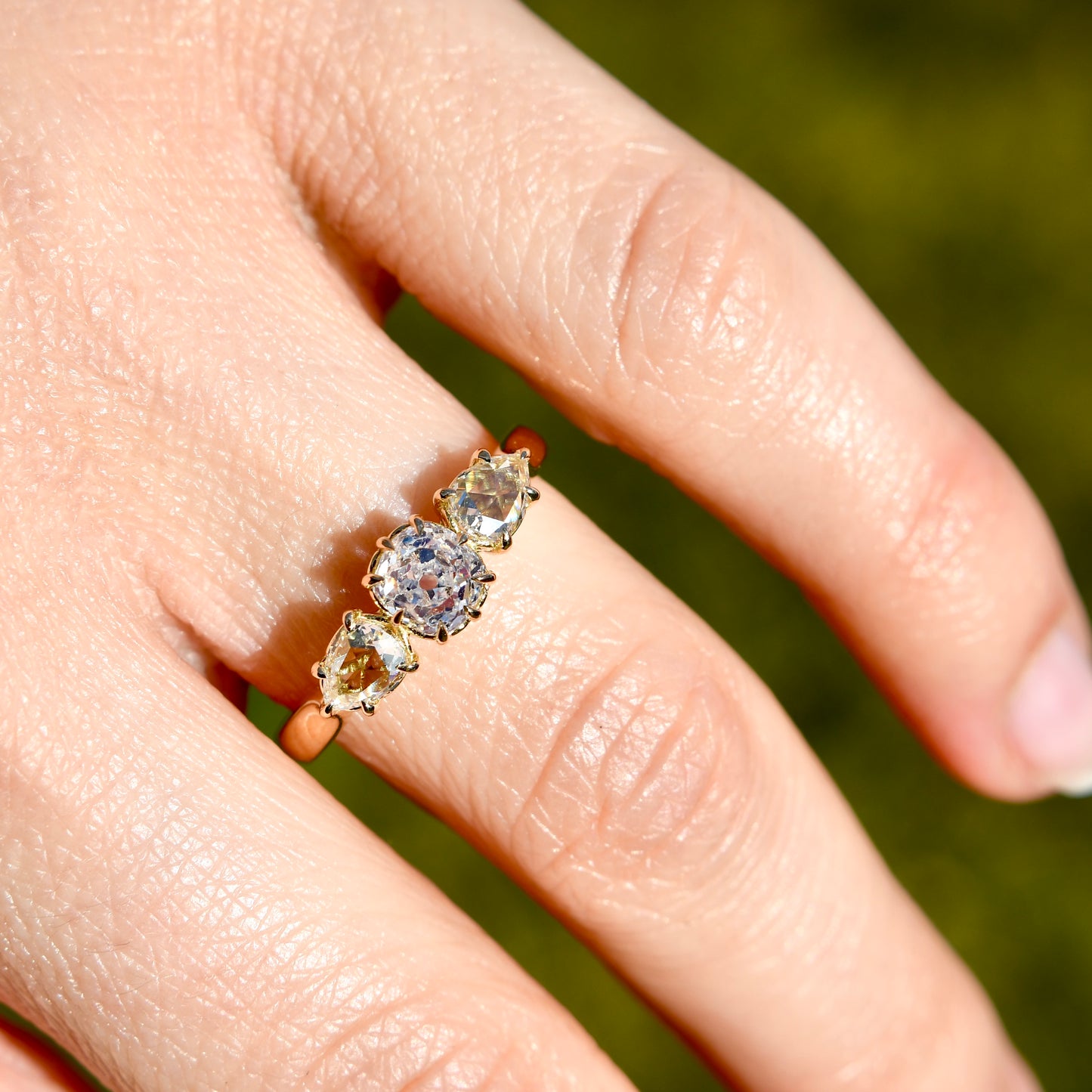 0.63 ct old mine and pear rose cut diamond three stone ring