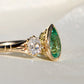 1.34 ct Colombian pear cut emerald and old mine cut diamond three stone ring