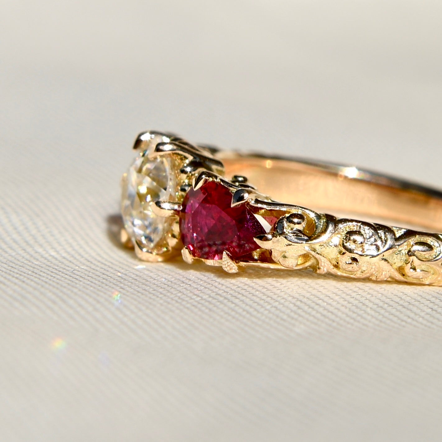 0.84 ct old European cut diamond and ruby three stone ring