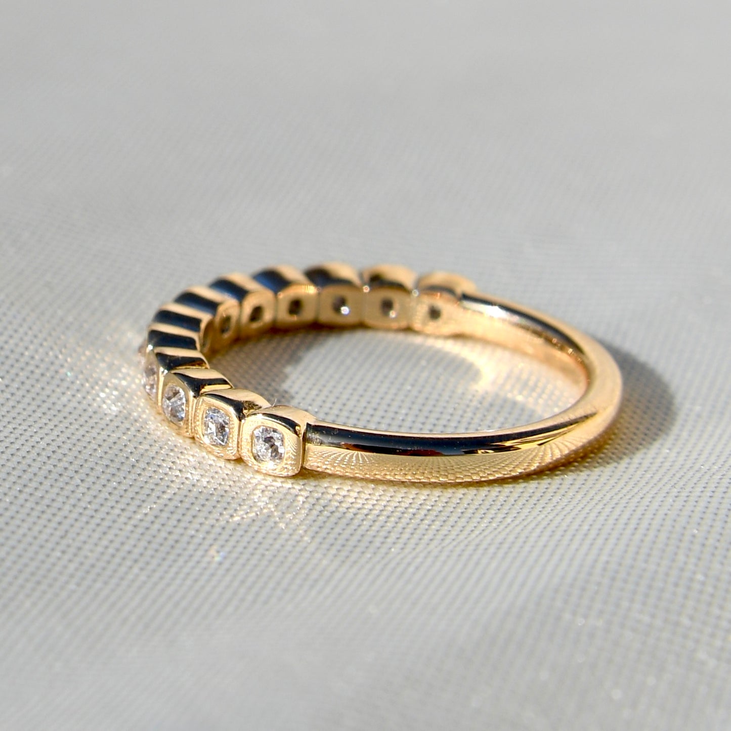 0.24 ct peruzzi cut diamond twelve stone band ring