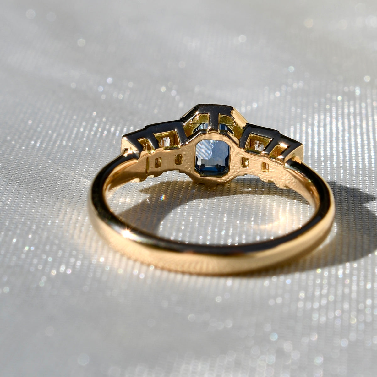 0.61 ct Ceylon sapphire and baguette cut diamond five stone ring
