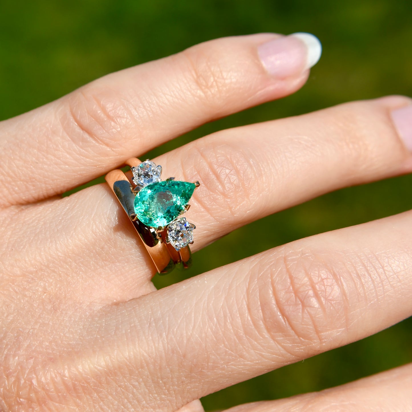 1.66 ct Colombian emerald and old mine cut diamond three stone ring