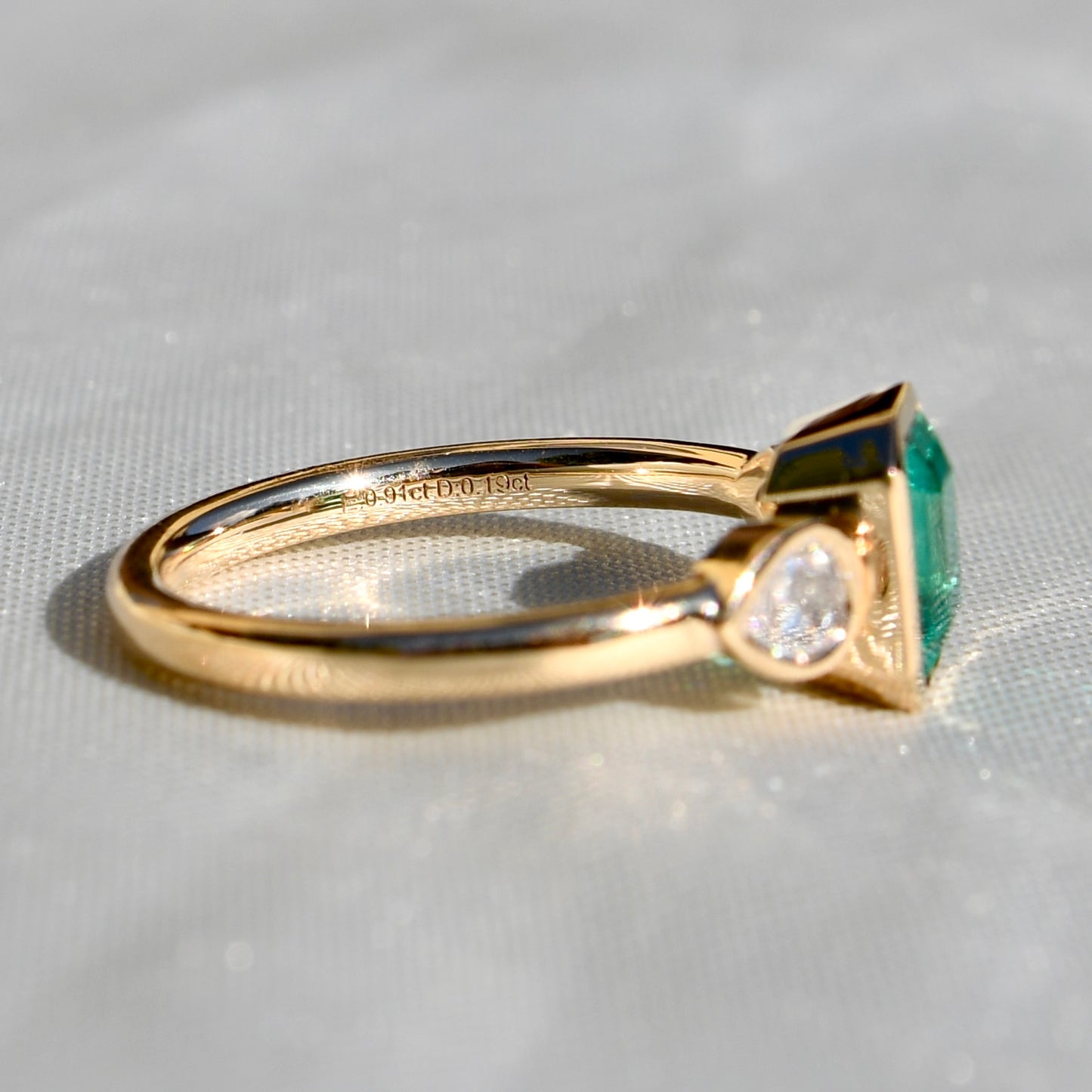 0.91 ct Colombian emerald and pear rose cut diamond three stone ring